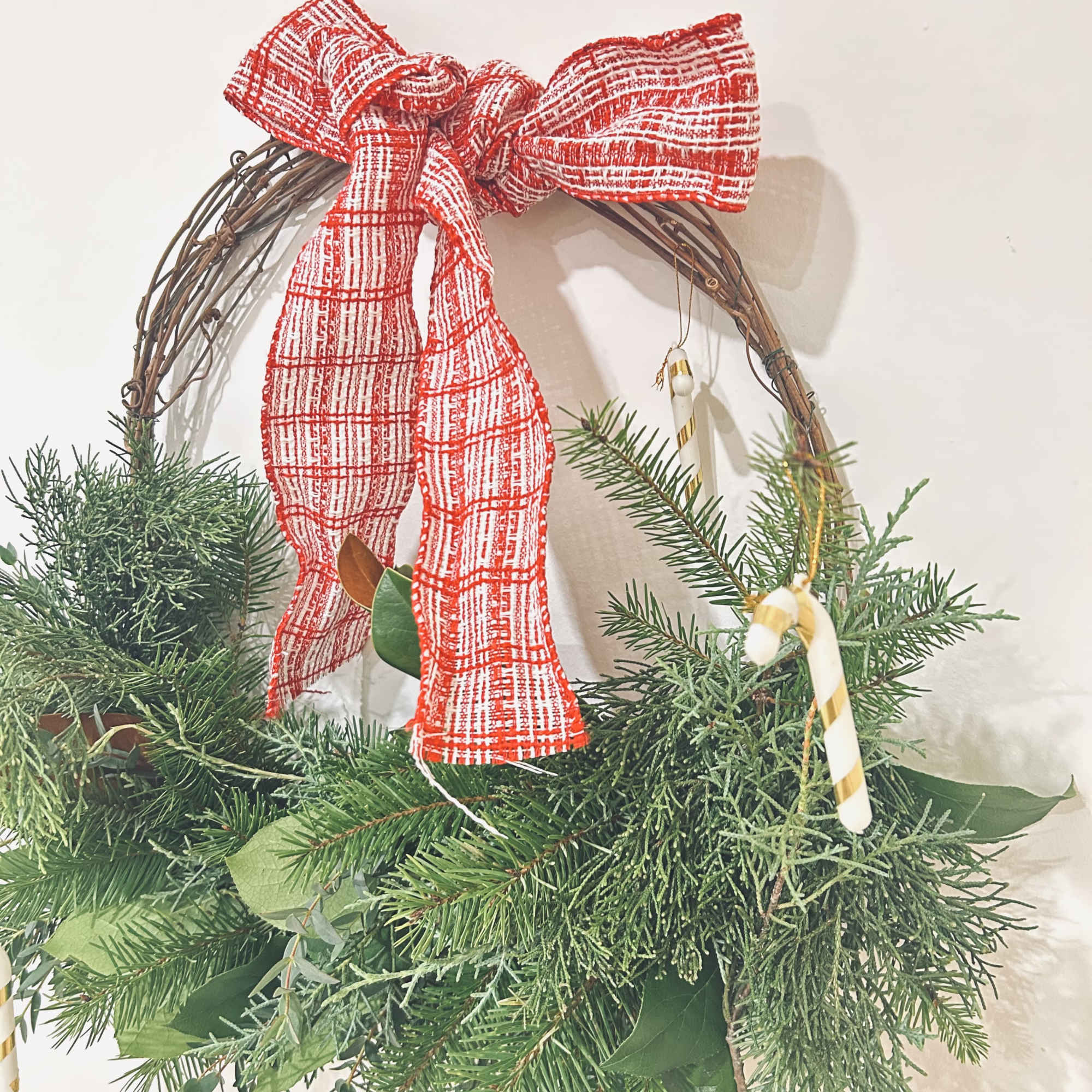 Wreath is available in one size. Decorated with Christmas greenery, ribbons, &amp;