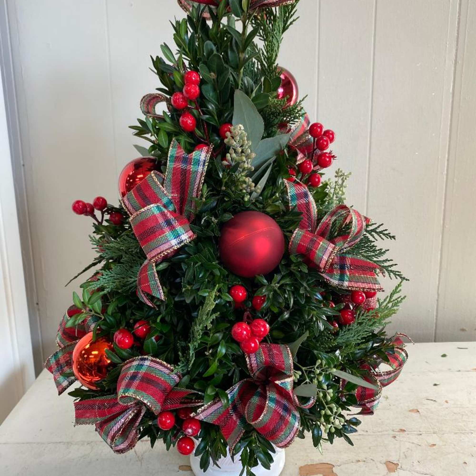 Each unique English boxwood arrangement mimics a real tree and its one