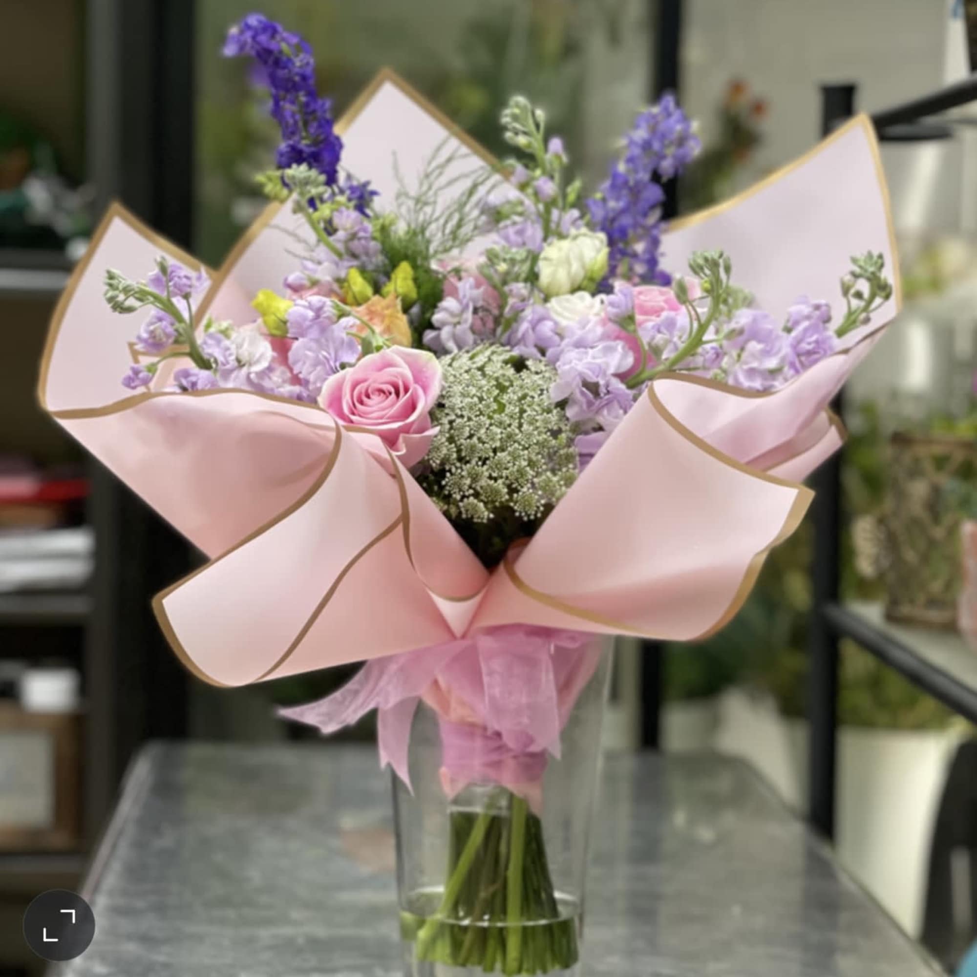 A wonderful bouquet of flowers hand-tied together as if picked from the