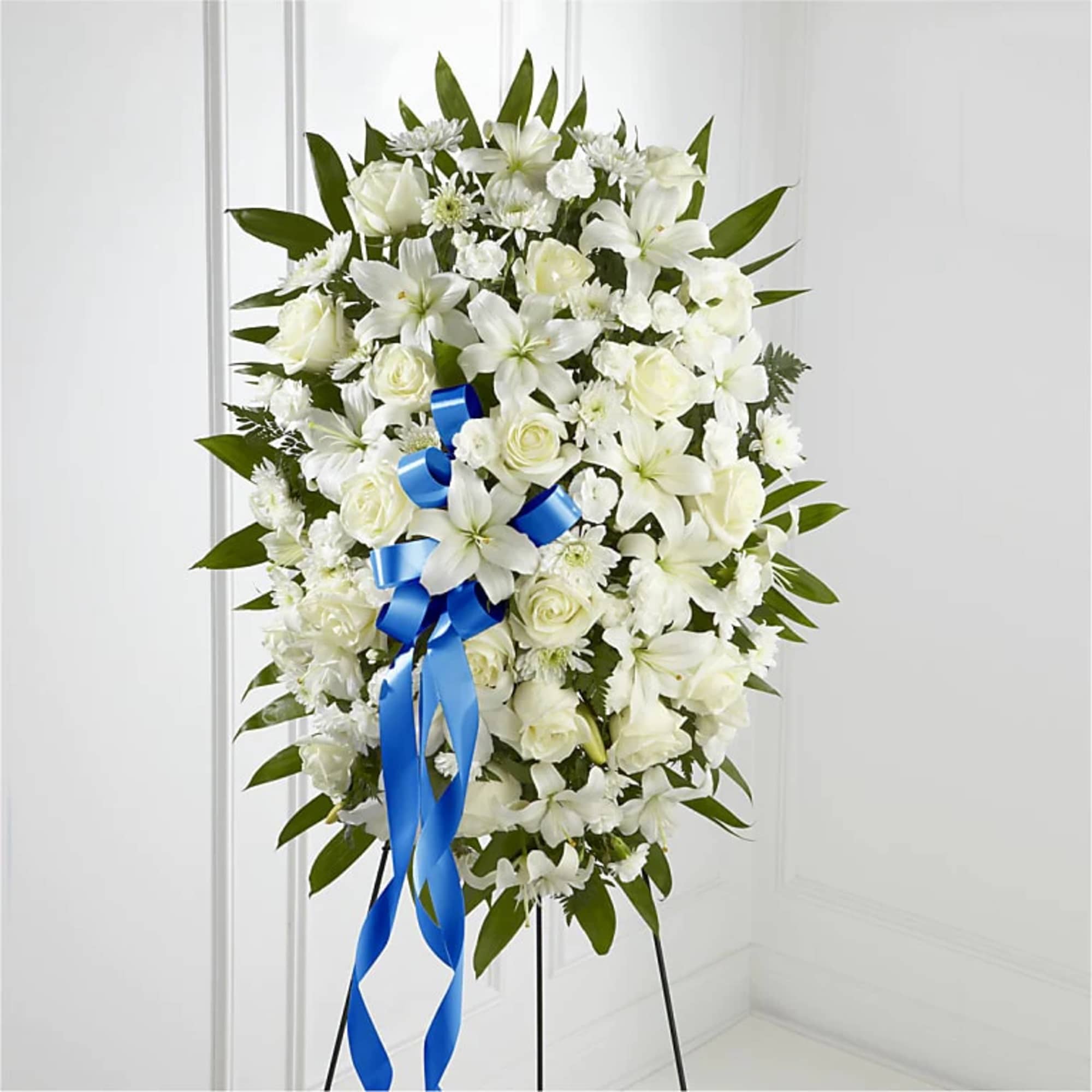 The Exquisite Tribute Standing Spray is an elegant display of sweet serenity.