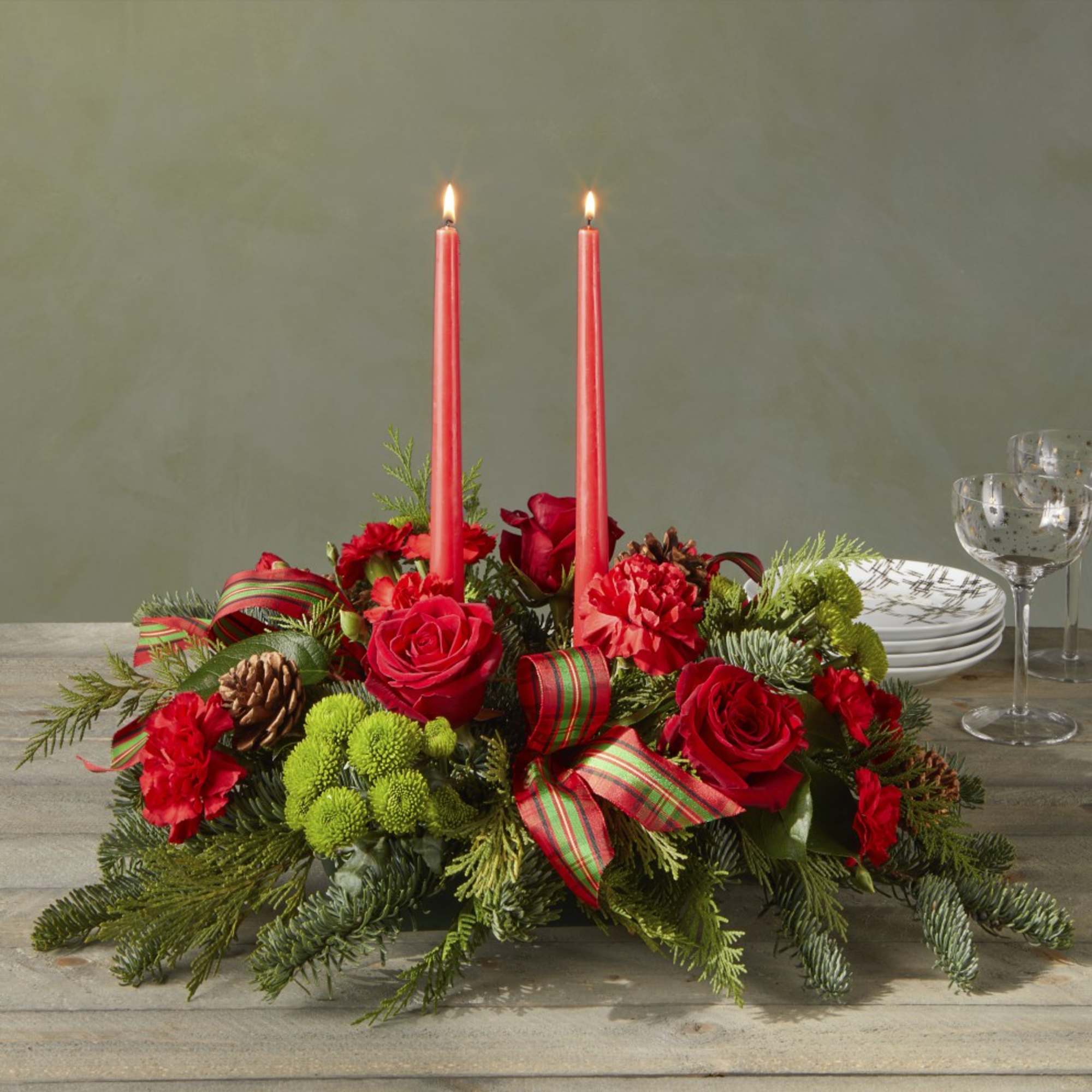 By the Candlelight centerpiece graces the table as new holiday memories are