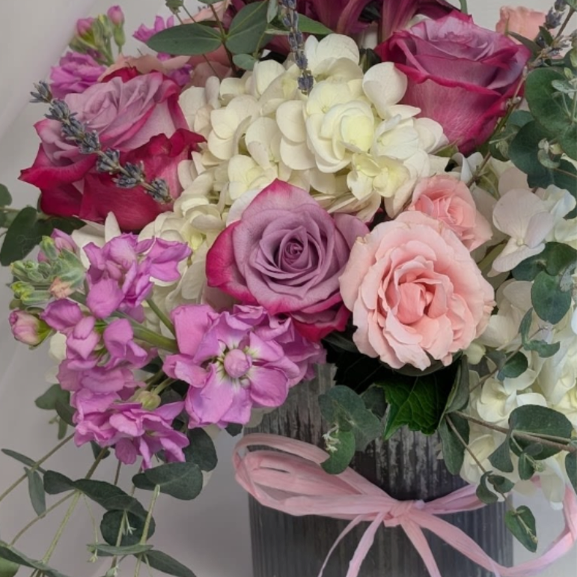 Collection of Hydrangea, Spray Roses, lavender,  in an old fashioned rustic