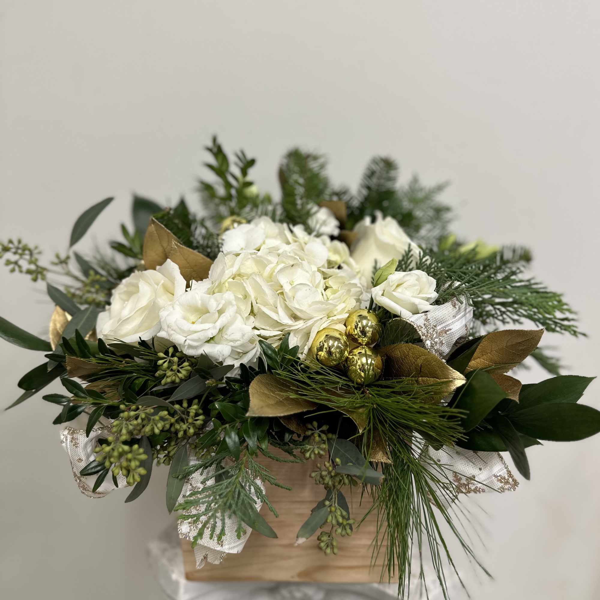 Elevate your dining experience with White Christmas by Westford Florist Art by