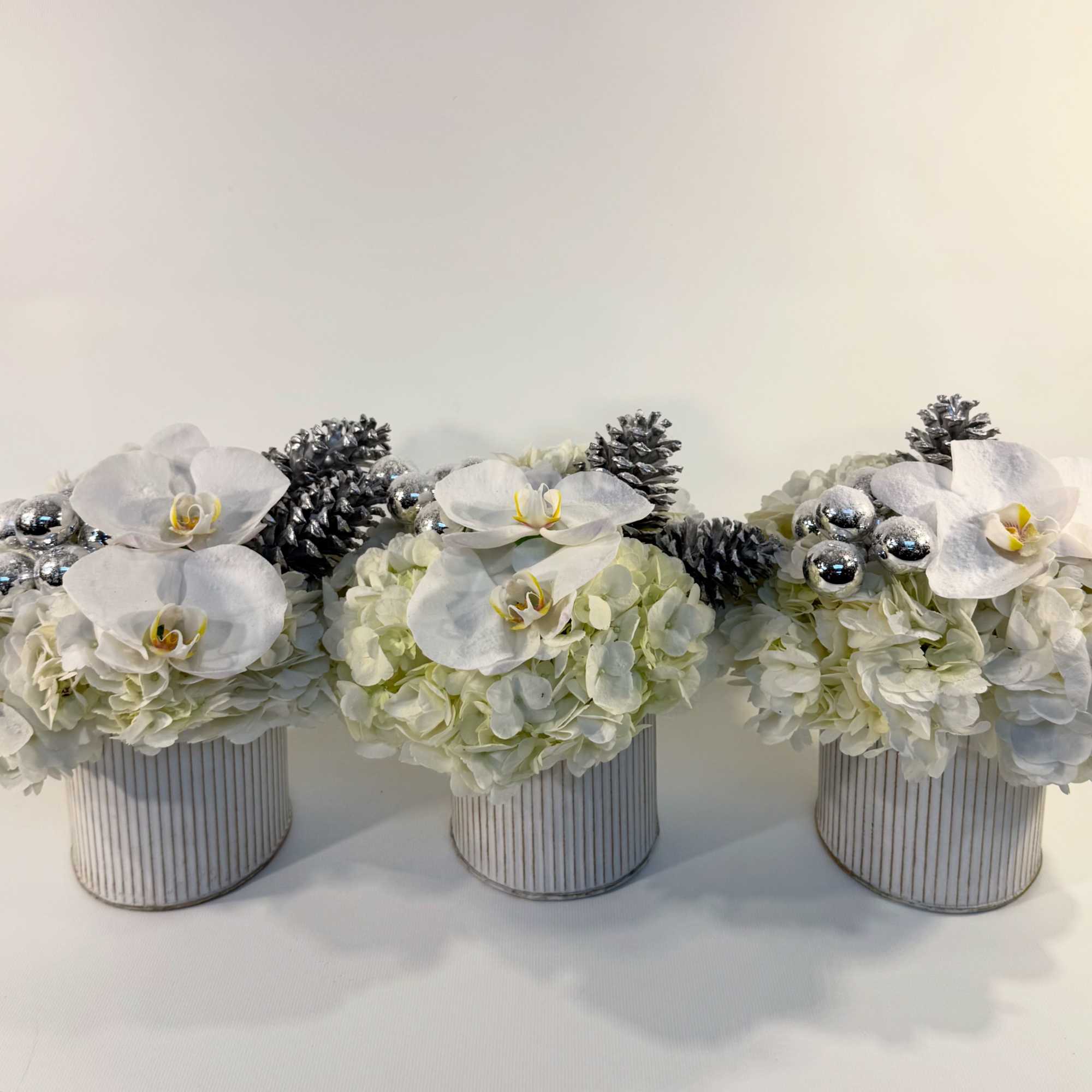 From our 2025 winter collection. This trio of modern centerpieces are the