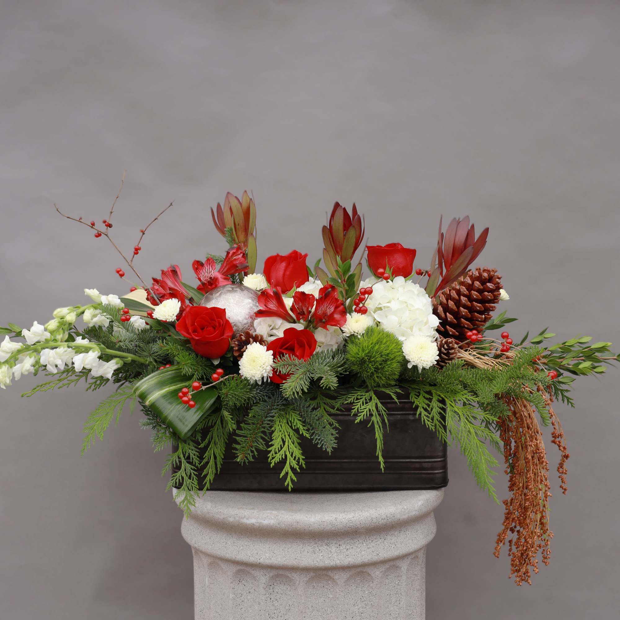 A festive fresh holiday arrangement that will bring joy to the world