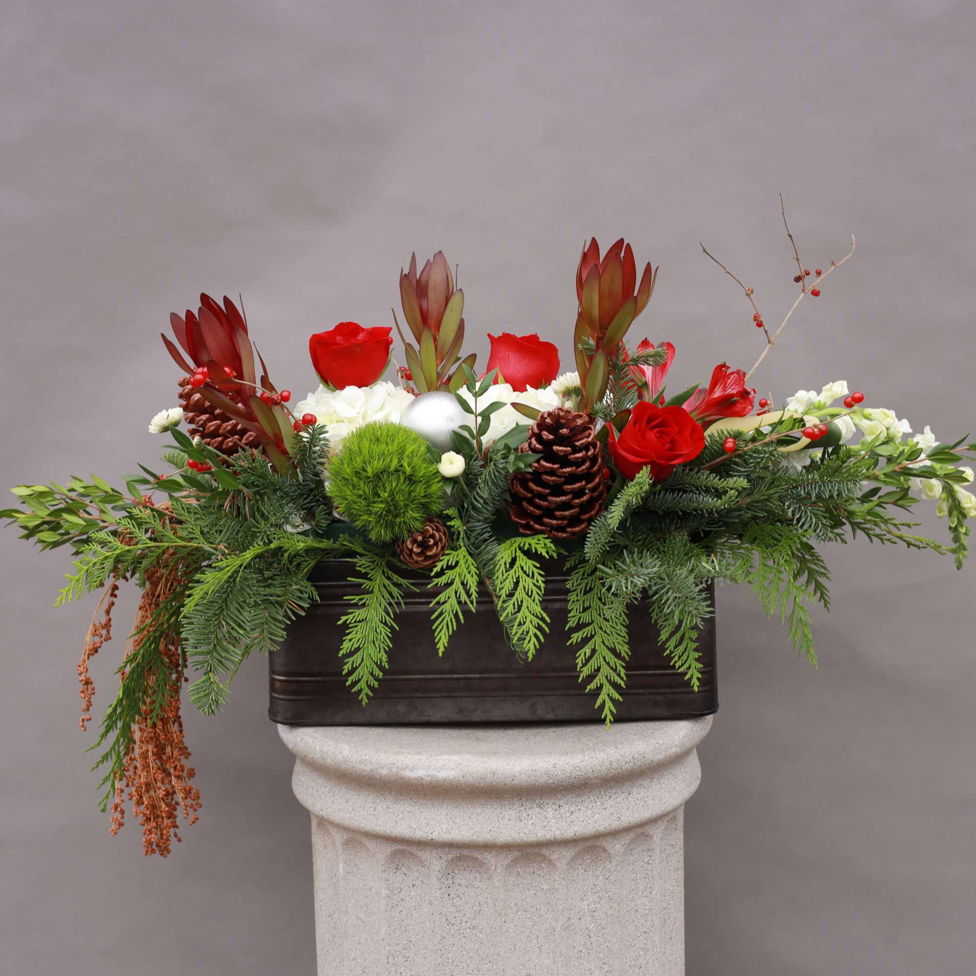 A festive fresh holiday arrangement that will bring joy to the world
