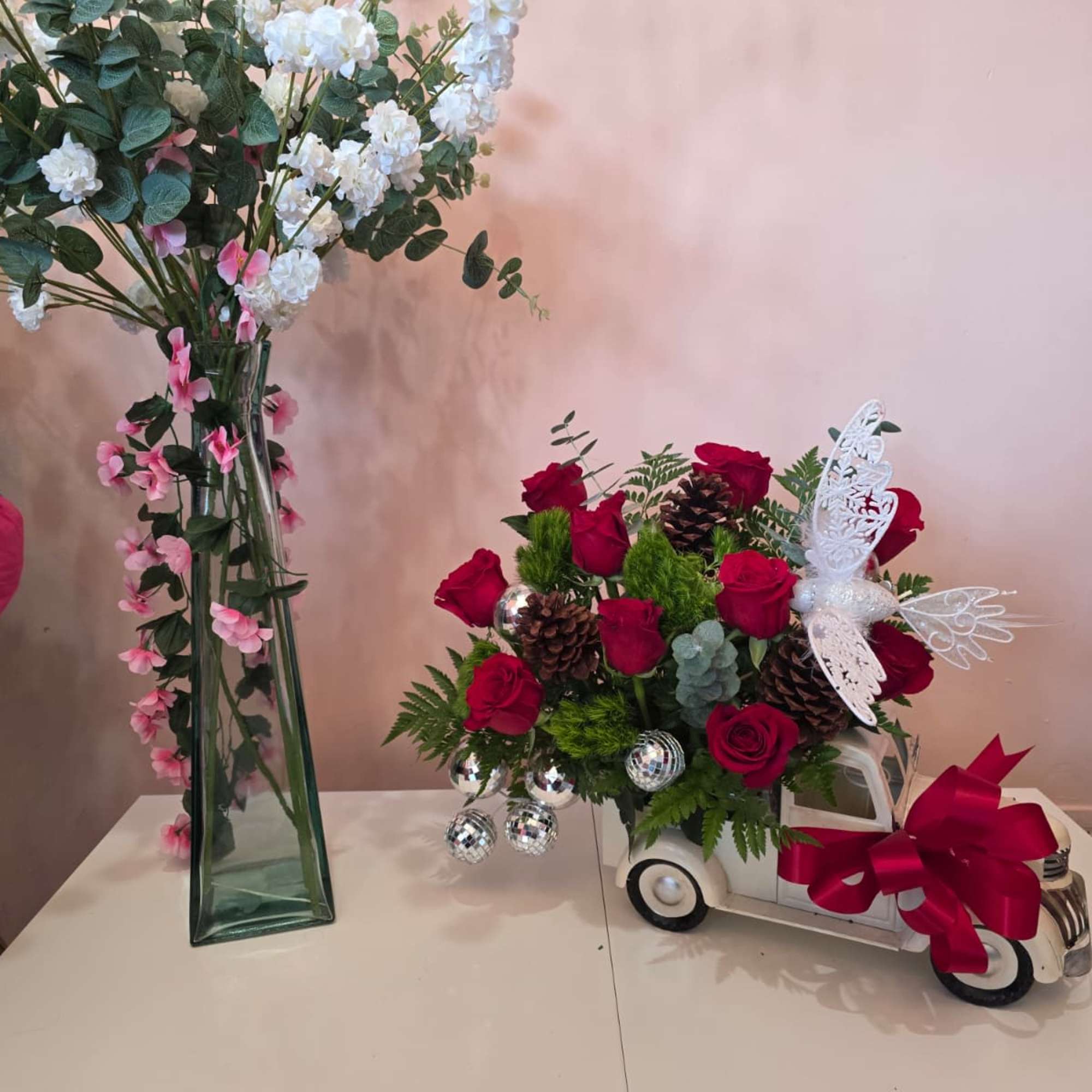 A Christmas cart decorated with roses, acorns, and delicate details that will