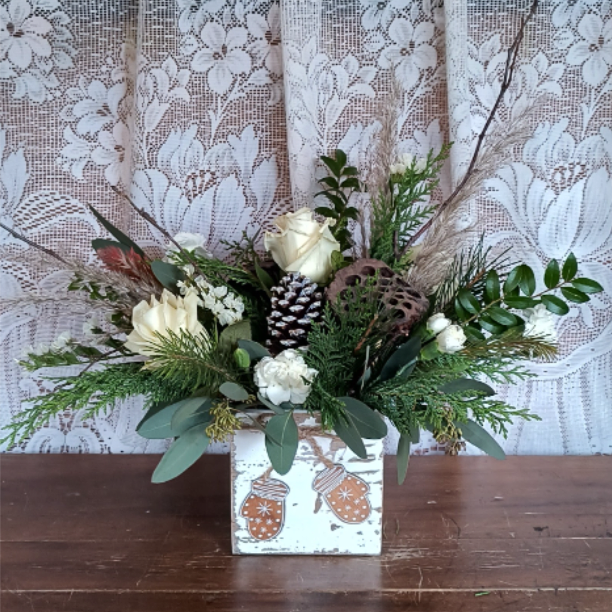 This winter arrangement is naturally elegant in a cute mittens wooden box.