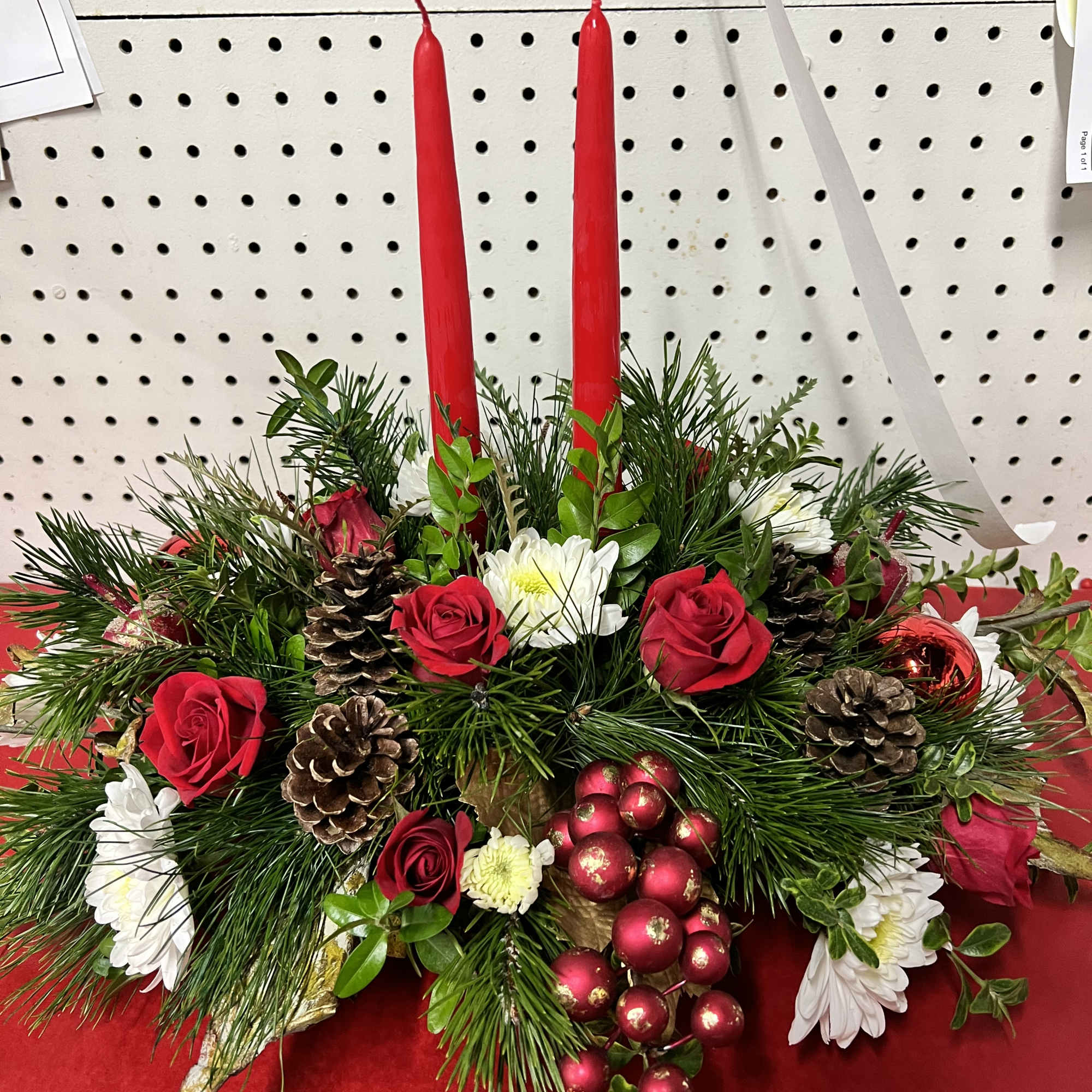 Mixed Christmas theme fresh cut flowers with pinecones, Christmas ornaments, fresh pine