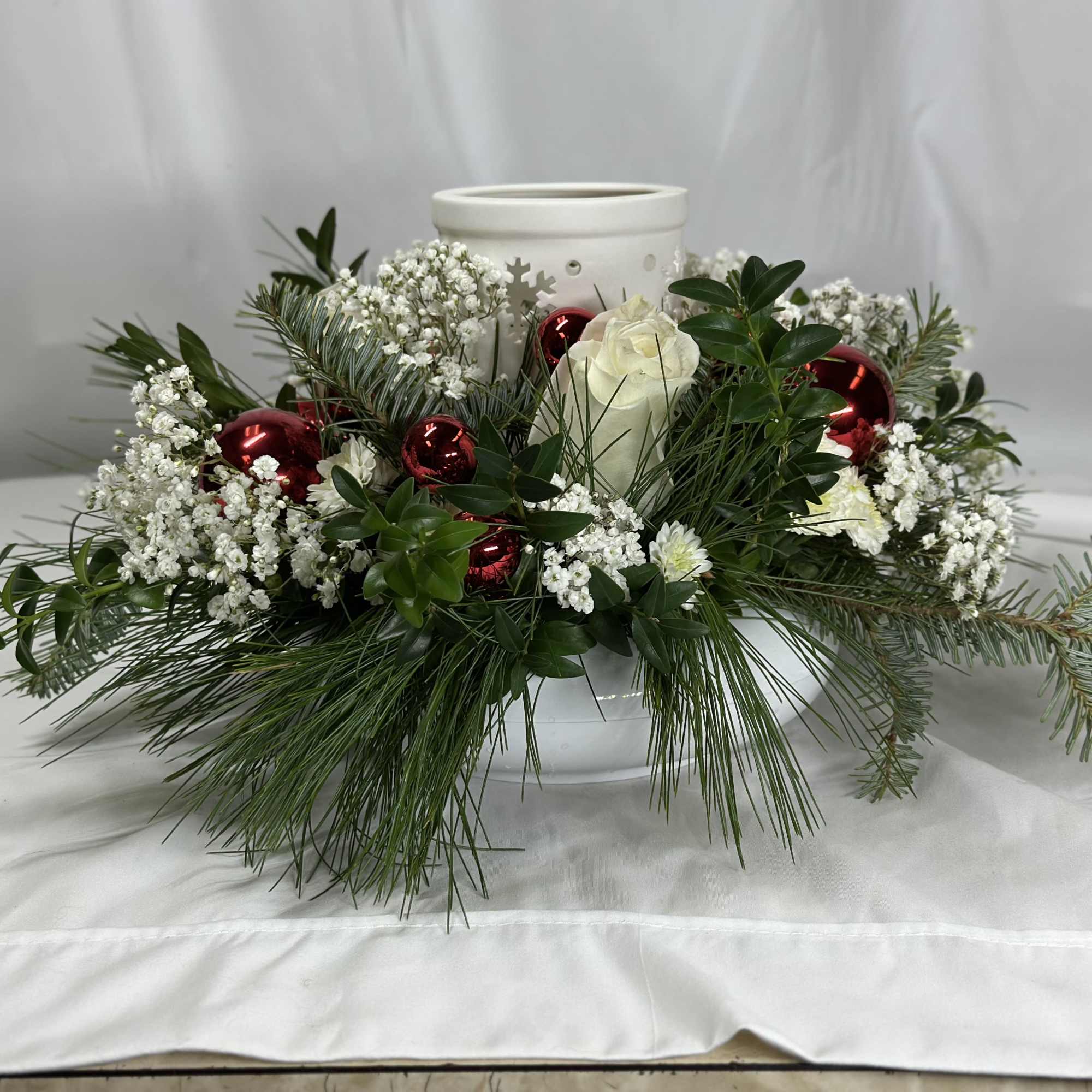 This Christmas flower arrangement is so versatile and pretty. It's a Leary's