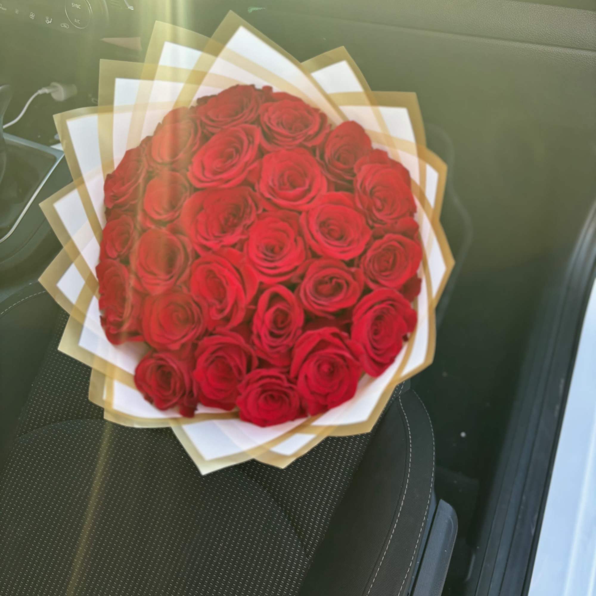 Sweet bouquet of Red 25 Ecuadorian Roses, with a light pink wrap.