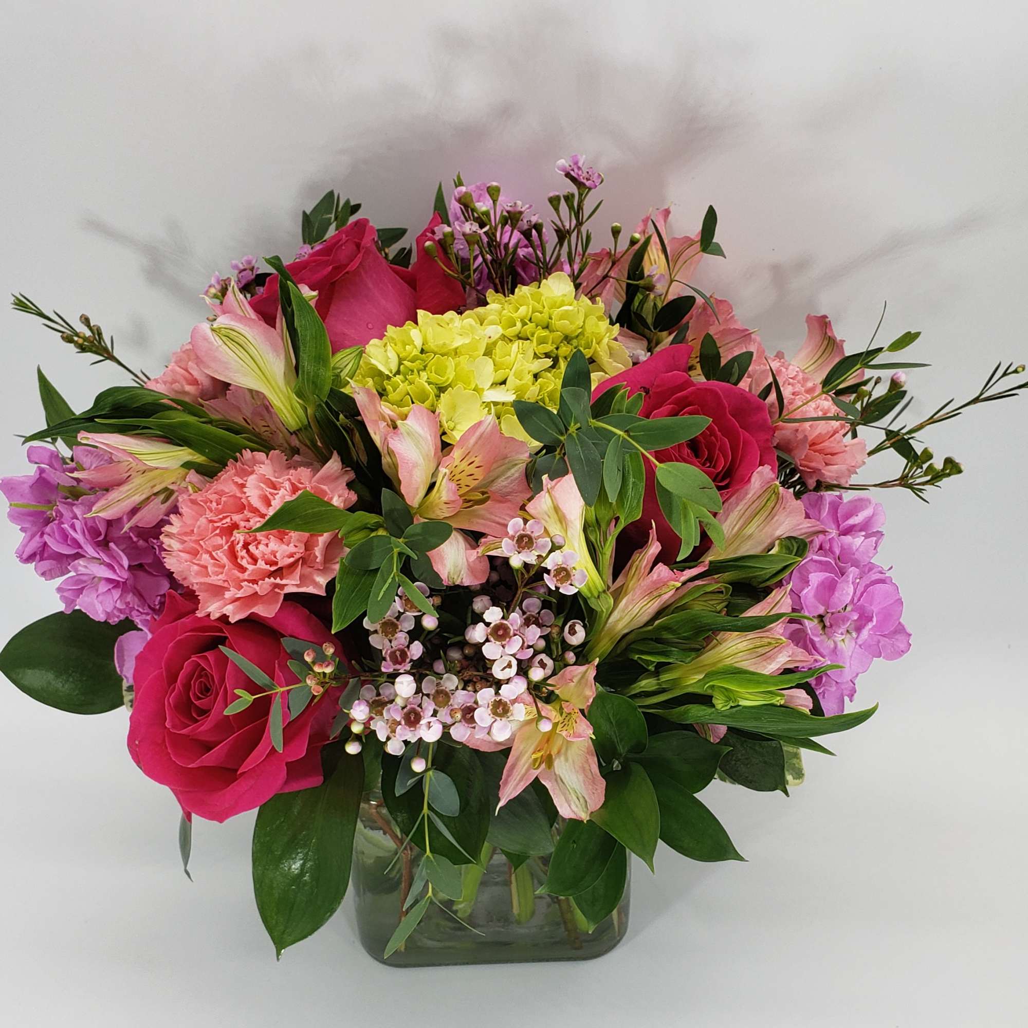 Shades of pink flowers and touch of purple and designed in a