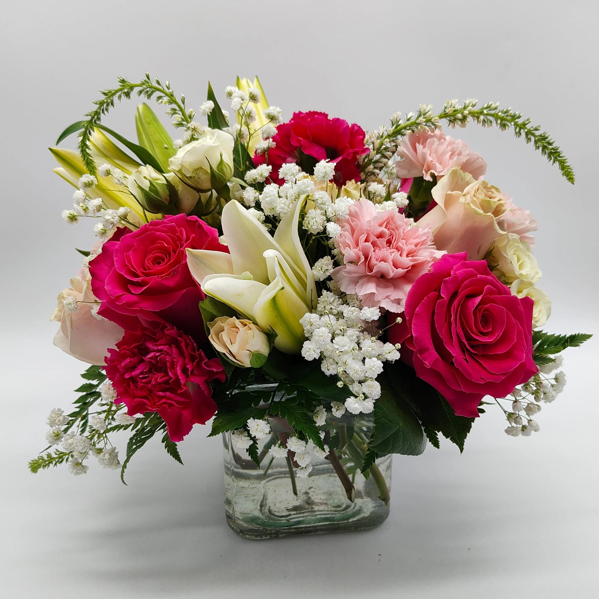 Shades of pink flowers and touch of purple and designed in a