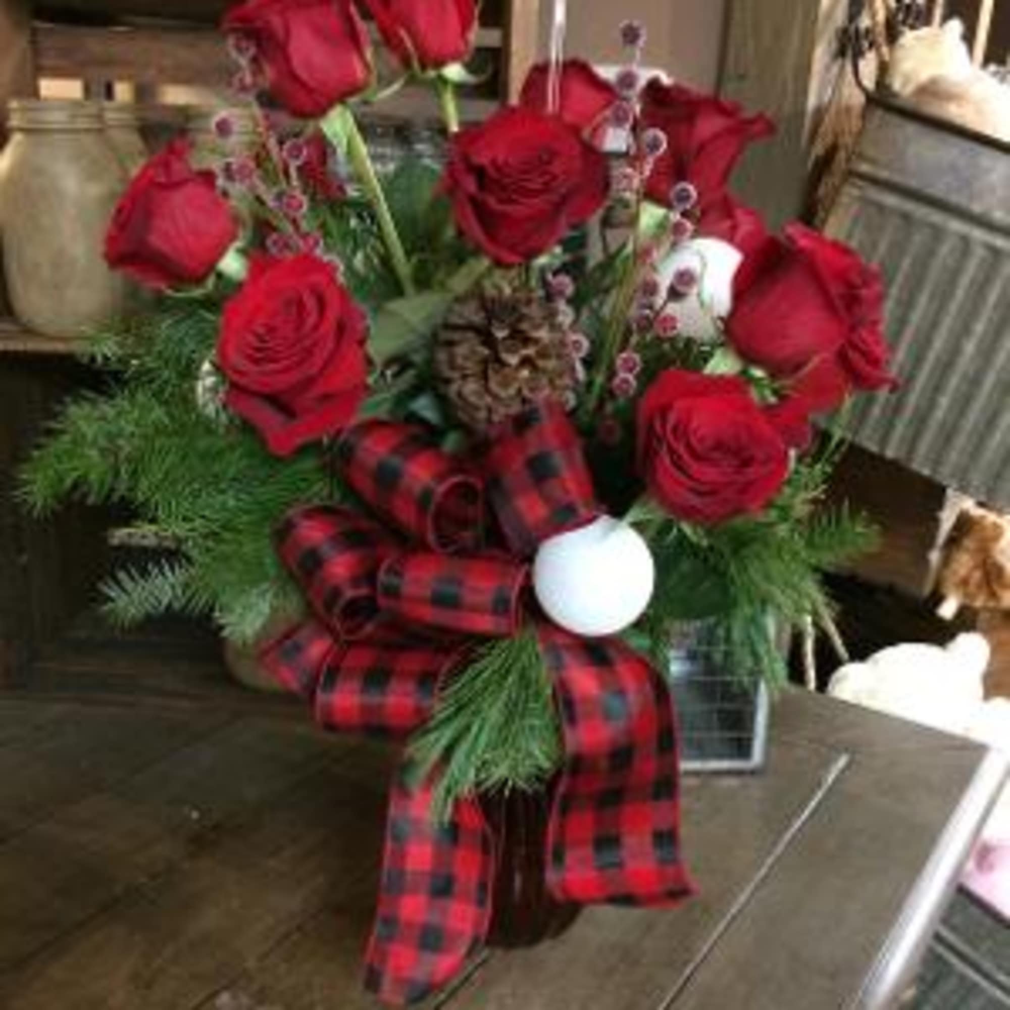 This beautiful red dozen roses is dressed up for the holiday. 