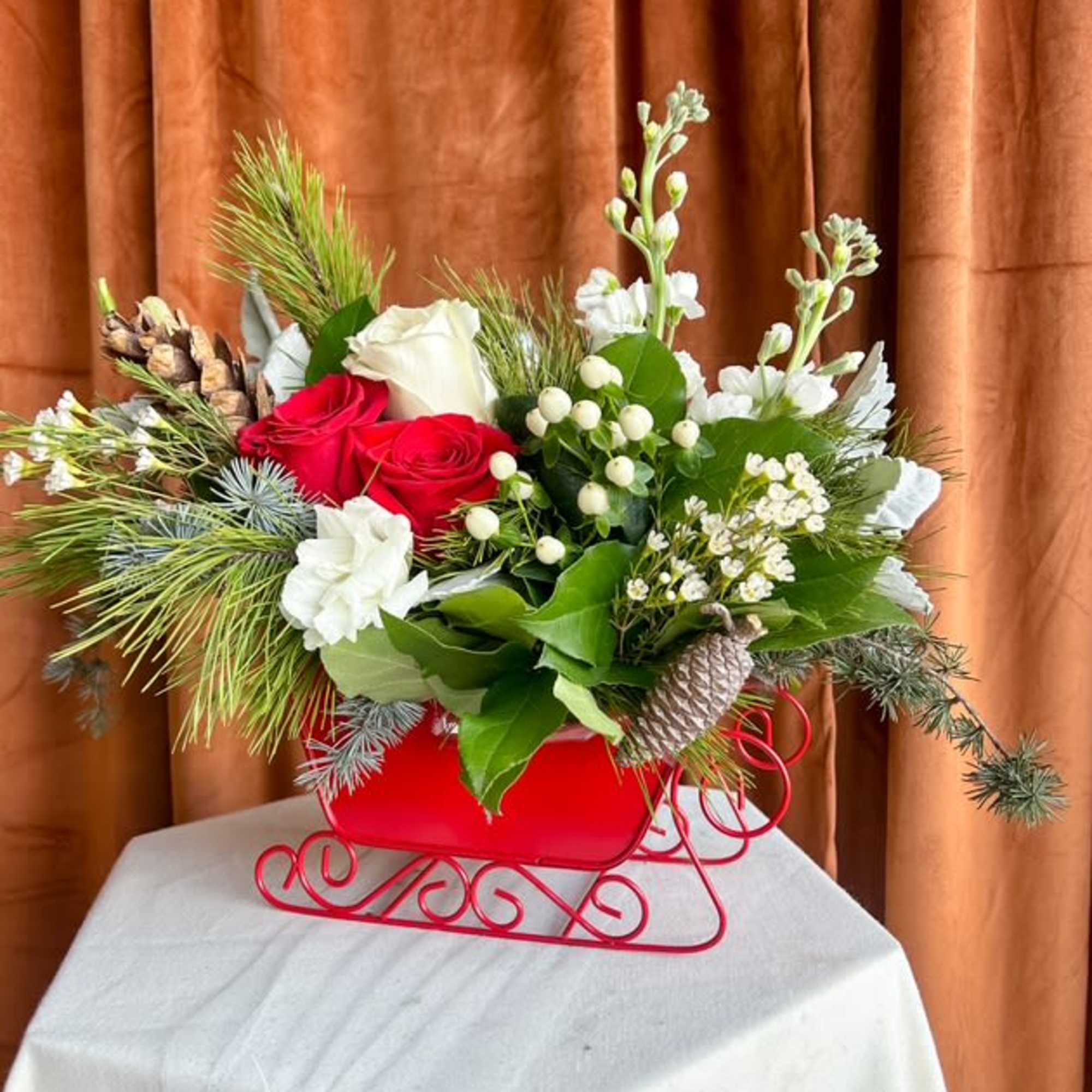 Celebrate the magic of the season with this charming winter centerpiece designed