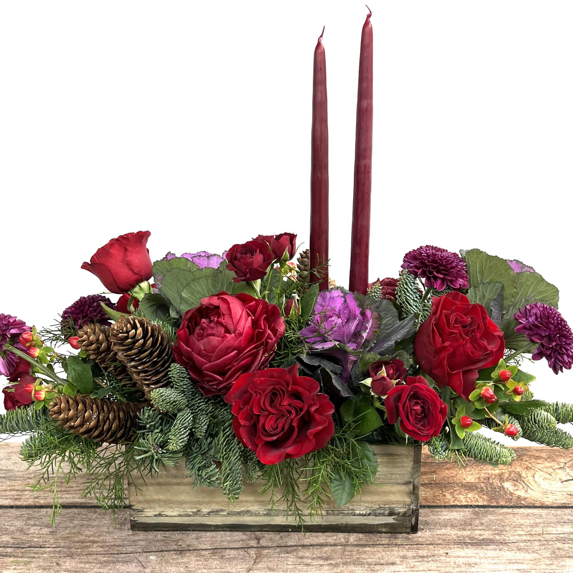A rustic display of flowers curated in a wooden container holds the