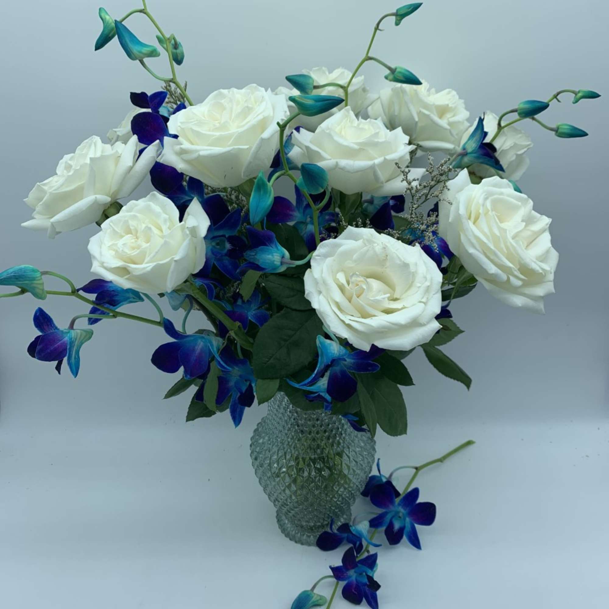 Send a classic gift of love with this vase of one dozen