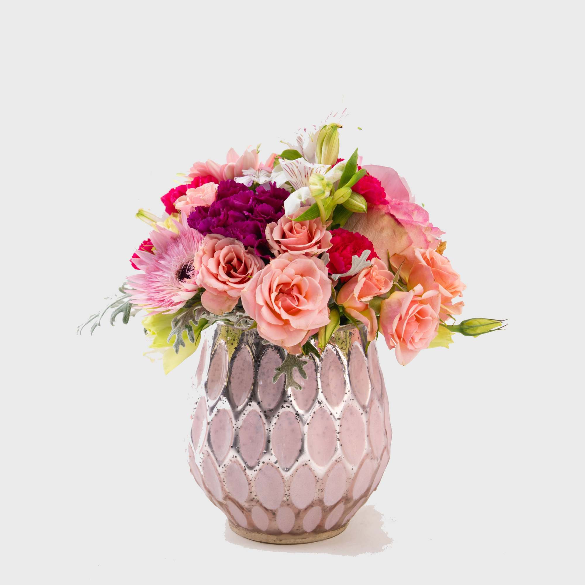 A beautiful bouquet of bright colored assortment of flowers including roses and