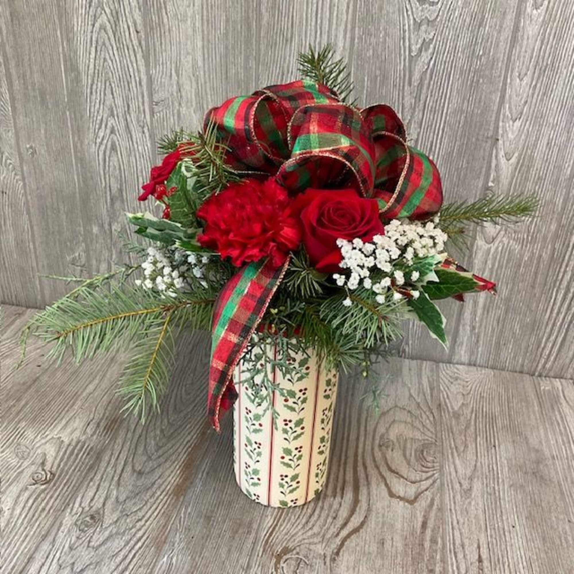Keepsake ceramic container decorated with festive holly.