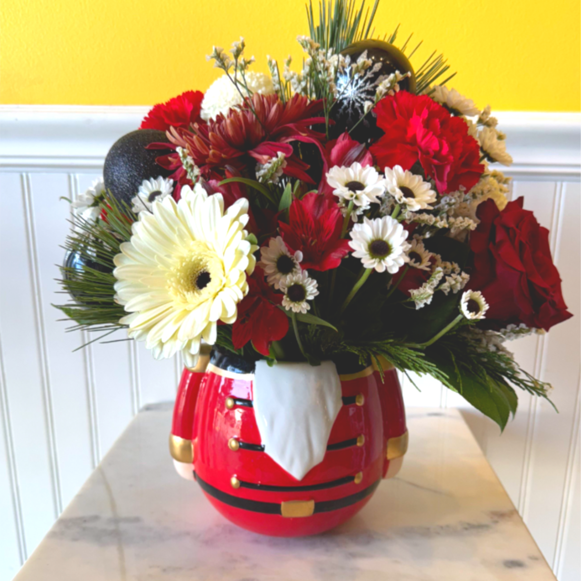 Add a dash of holiday charm with The Festive Nutcracker&mdash;a cheerful arrangement