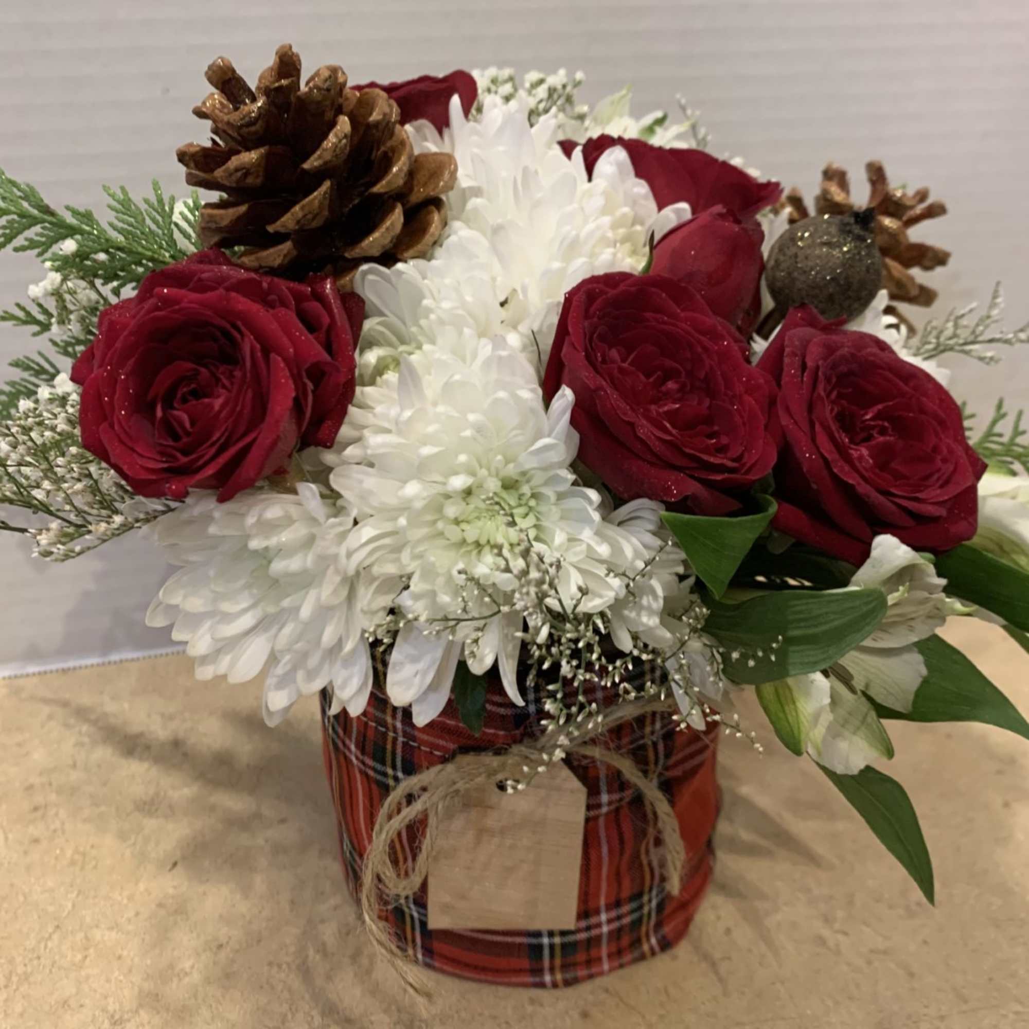 Send your best wishes for a Merry Christmas with this delightful arrangement.