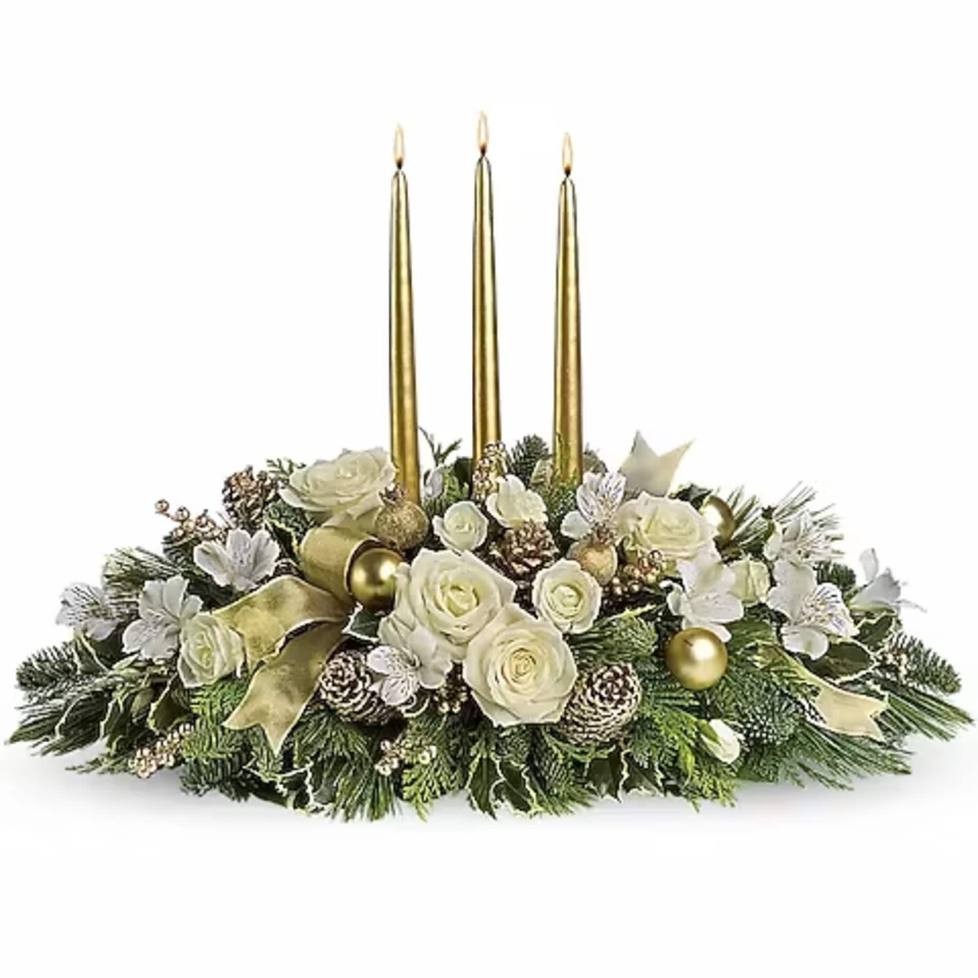 Three gorgeous gold taper candles take center stage in an arrangement of