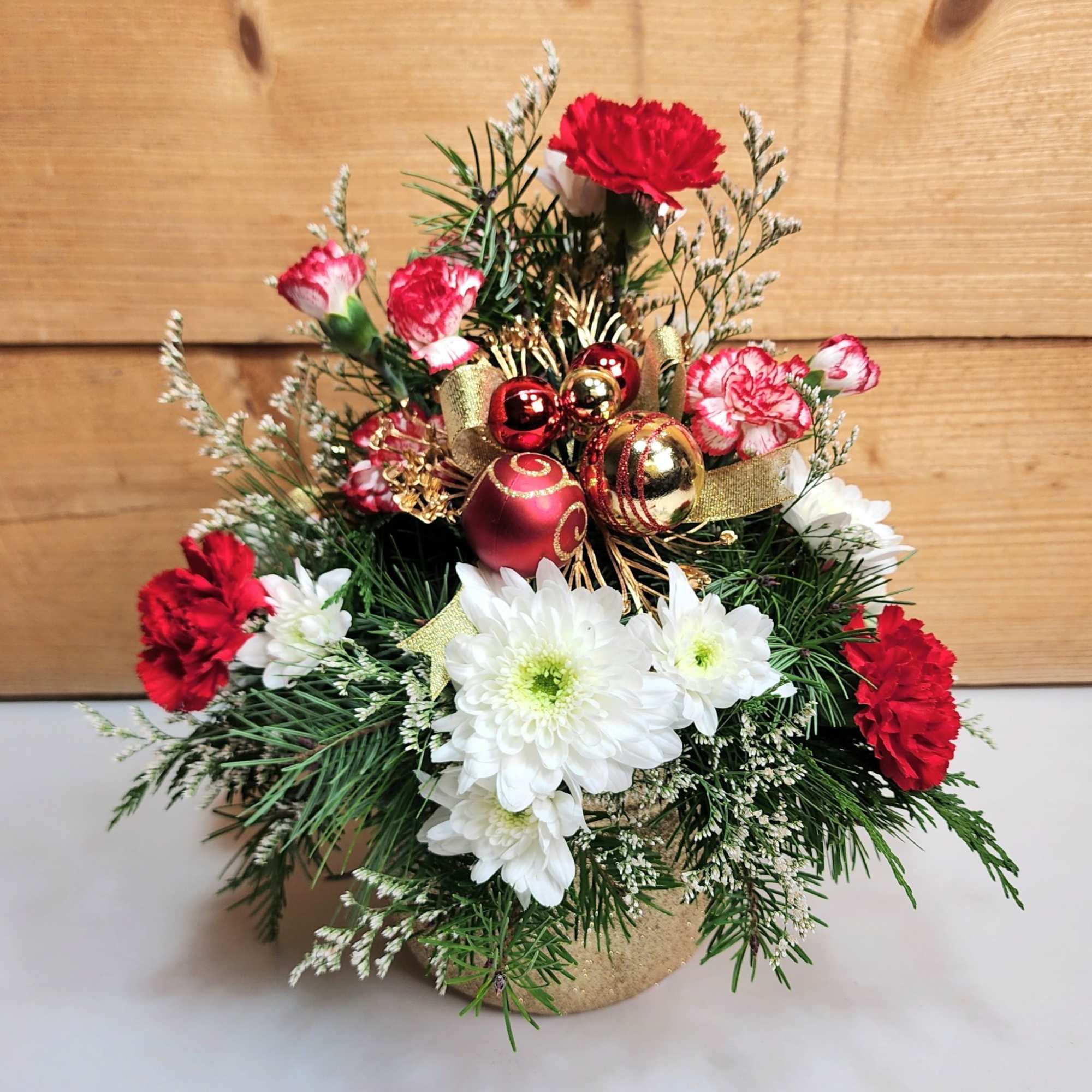 Santa&#039;s delivering a Holiday Haul this year, floral style! This arrangement comes