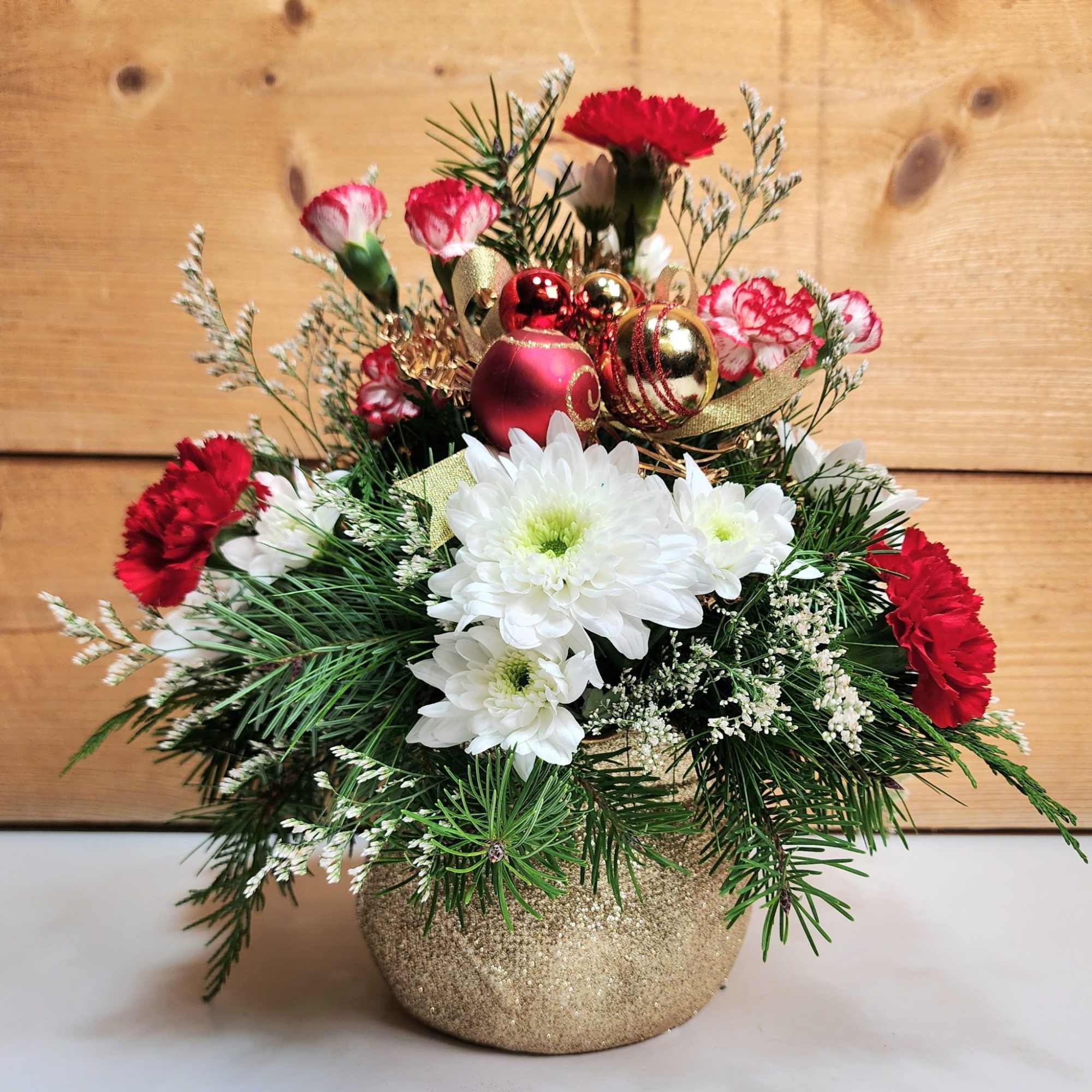 Santa&#039;s delivering a Holiday Haul this year, floral style! This arrangement comes