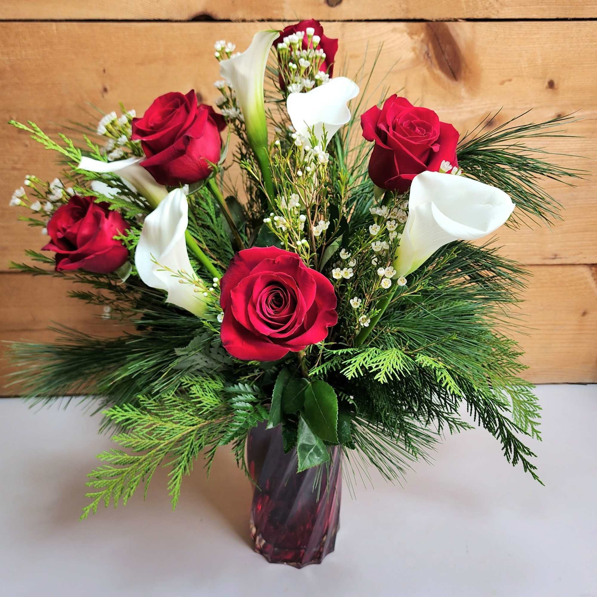 The Scarlet Splendor Bouquet is sure to be a showstopper this winter