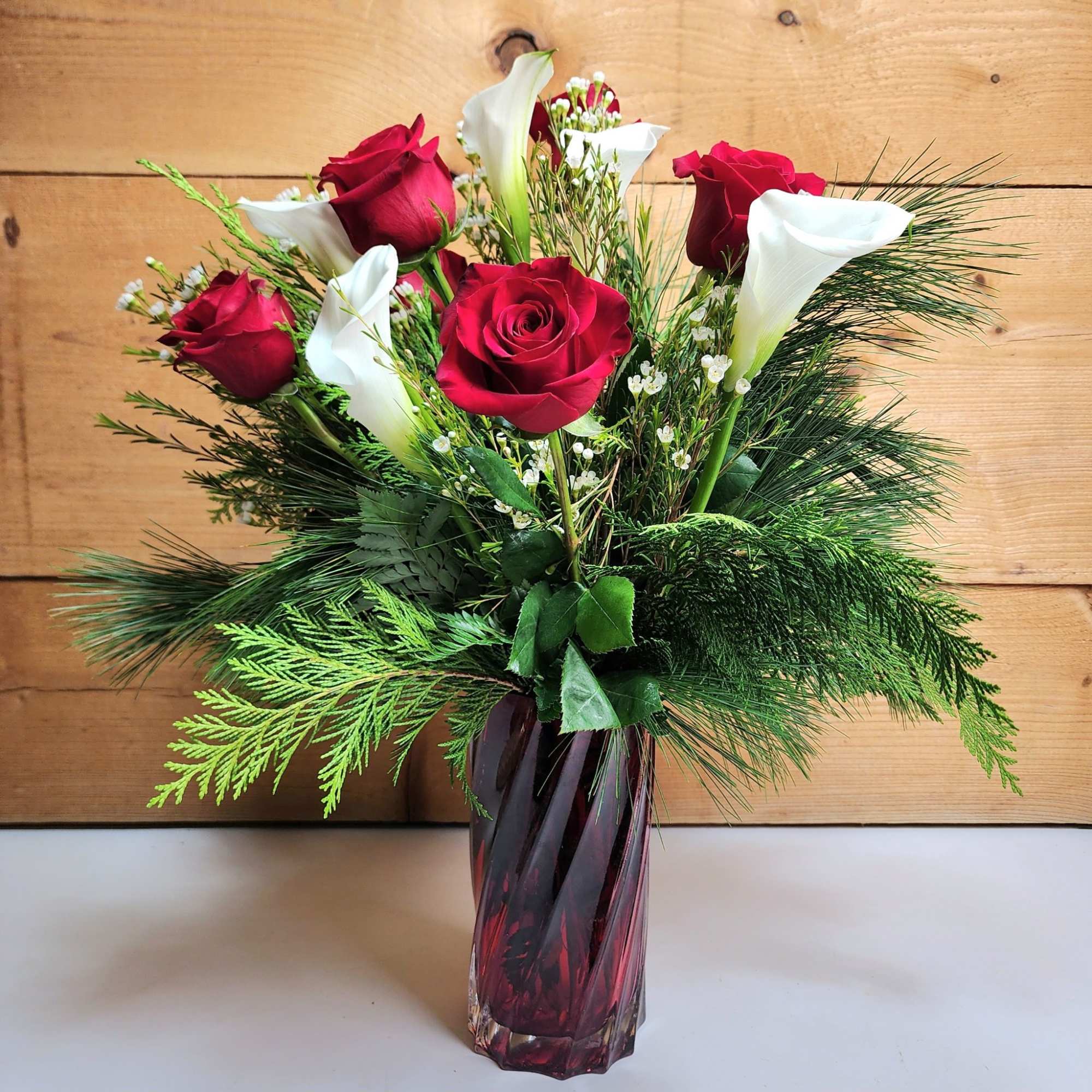 The Scarlet Splendor Bouquet is sure to be a showstopper this winter
