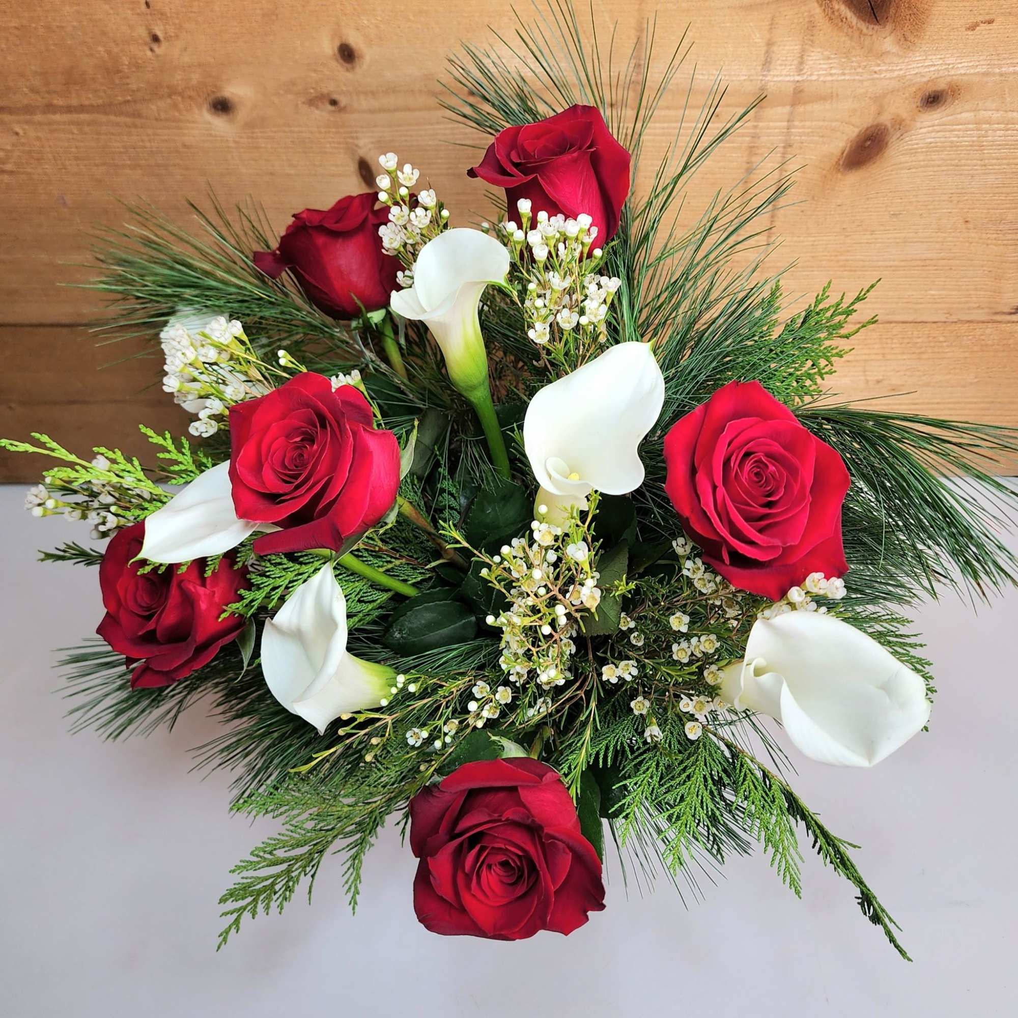 The Scarlet Splendor Bouquet is sure to be a showstopper this winter