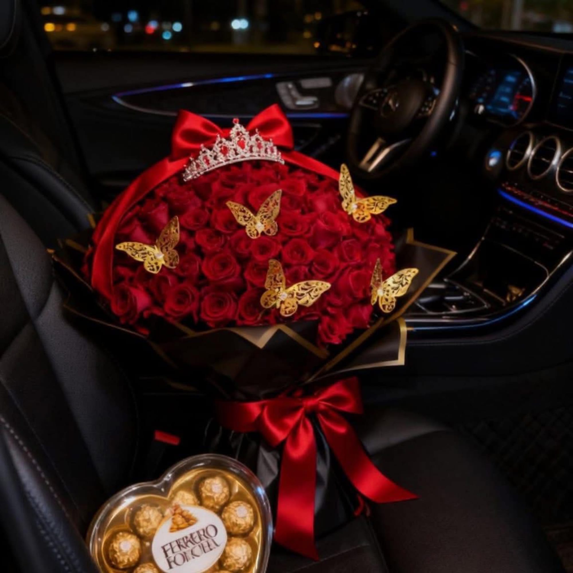 A bouquet of red roses wrapped with many details to make this