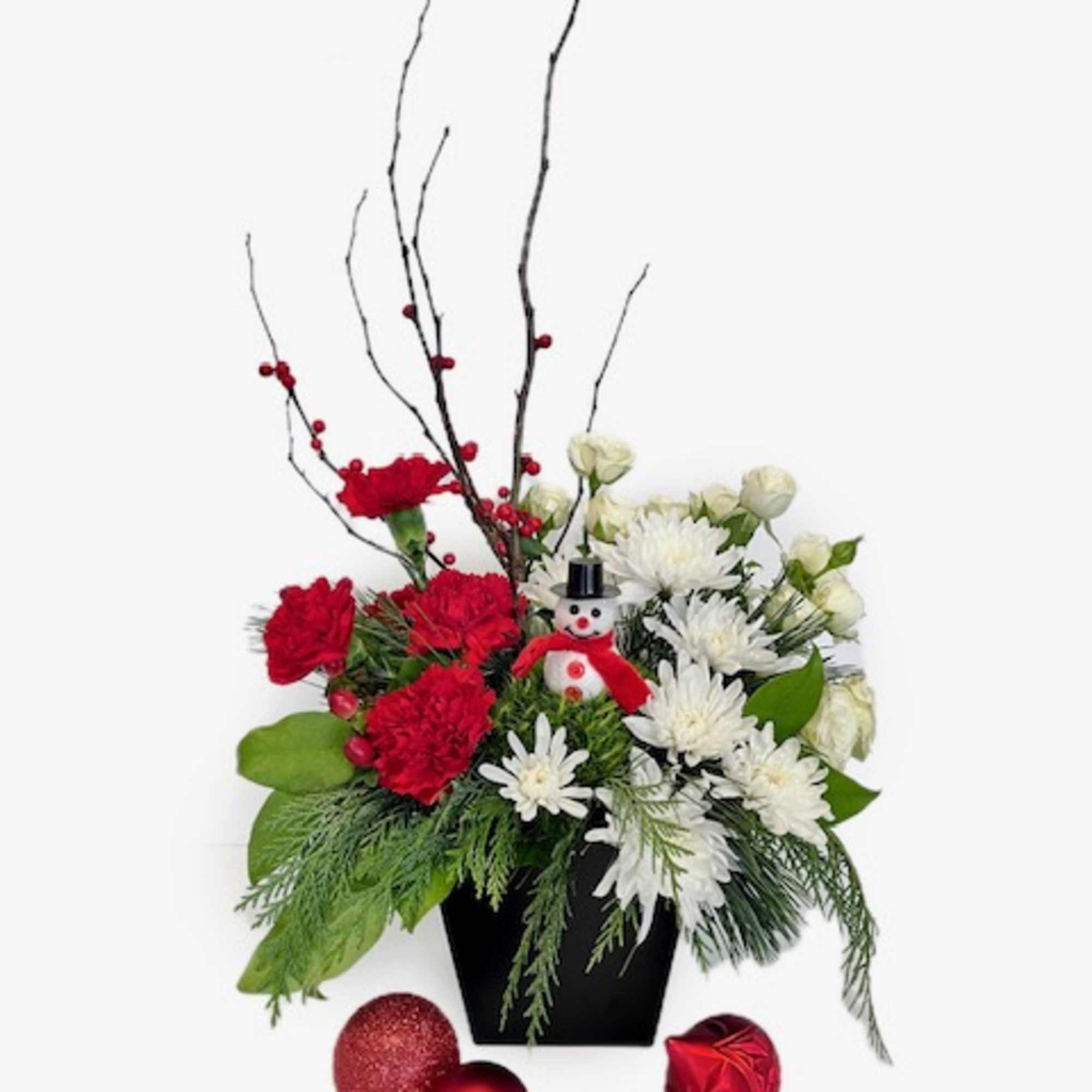 Meet 'Frosty's Favorite'&mdash;where timeless beauty meets holiday whimsy! This enchanting arrangement, dressed