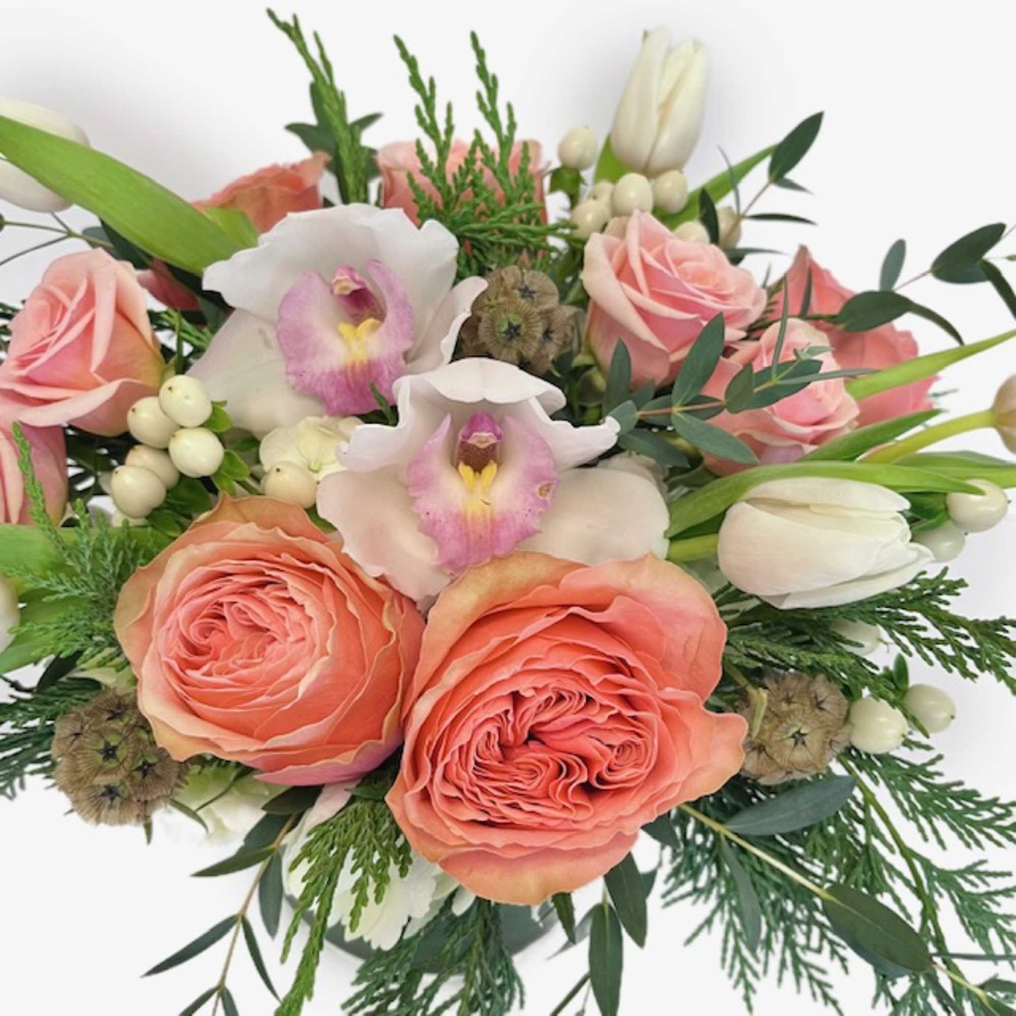 Step into warm winter wonder with our Peach Frost bouquet! Delicately curated