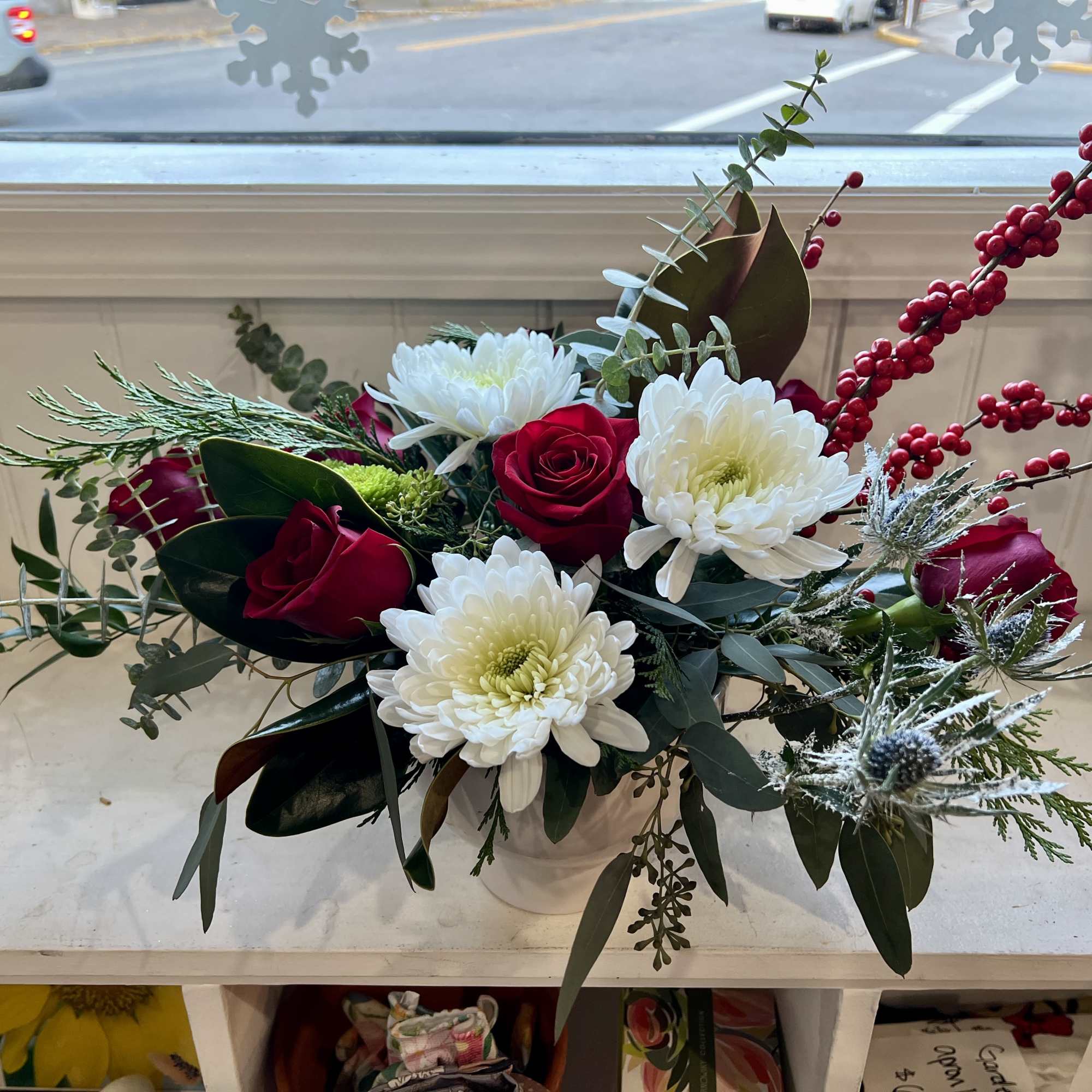 This gorgeous Christmas arrangement will shine bright like a diamond everywhere it