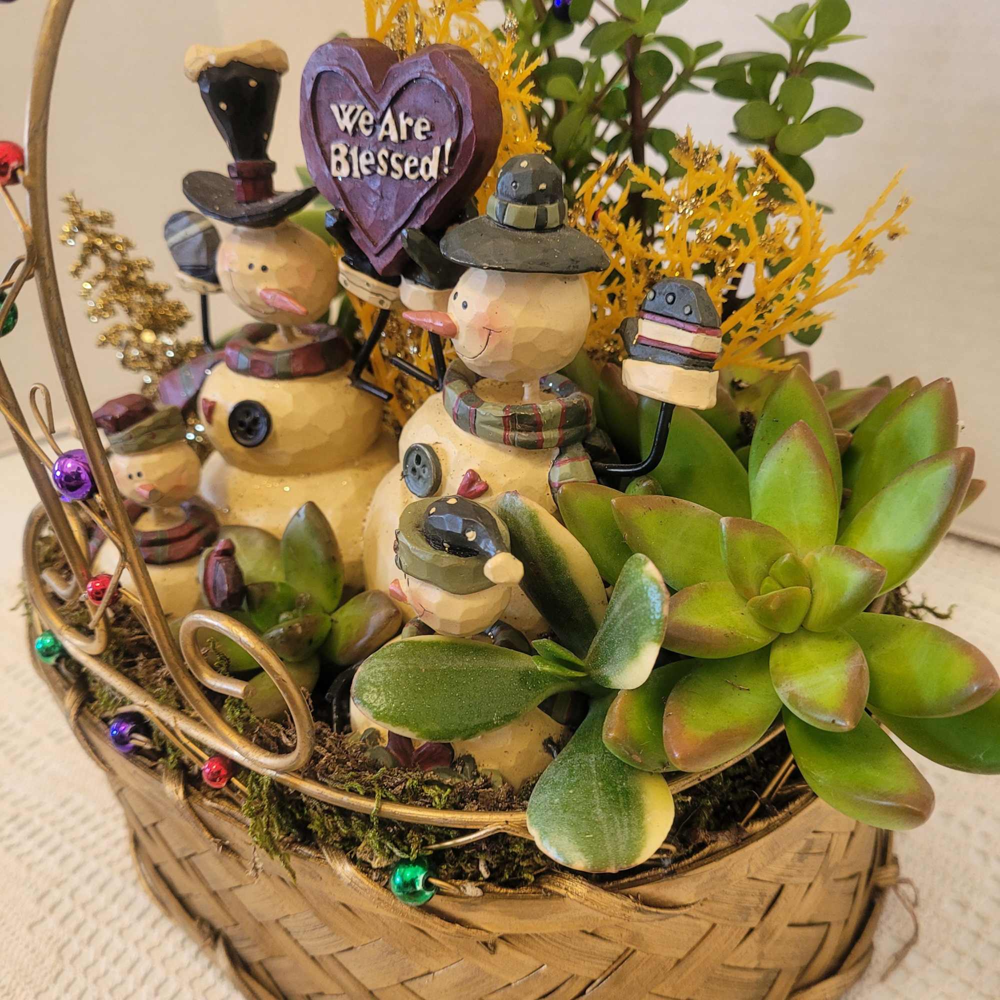 This wire and woven basket is filled to the brim with succulents