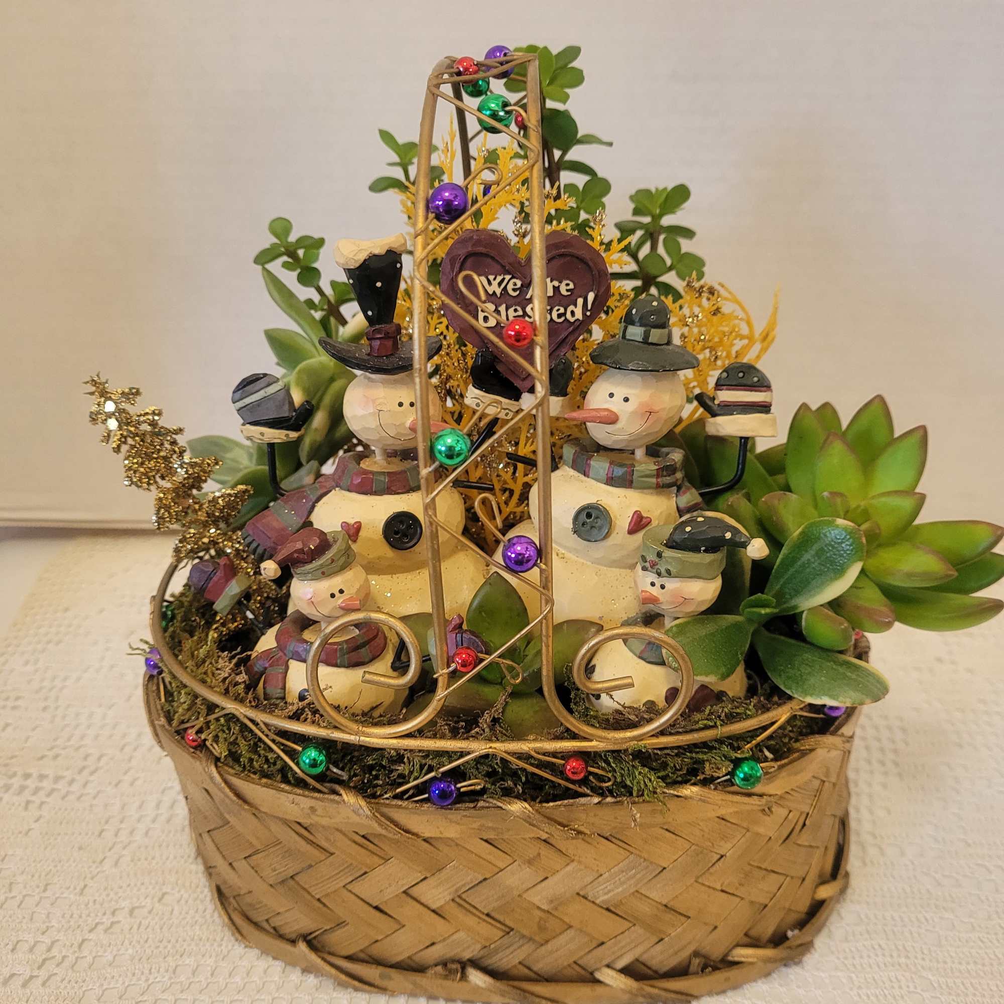 This wire and woven basket is filled to the brim with succulents