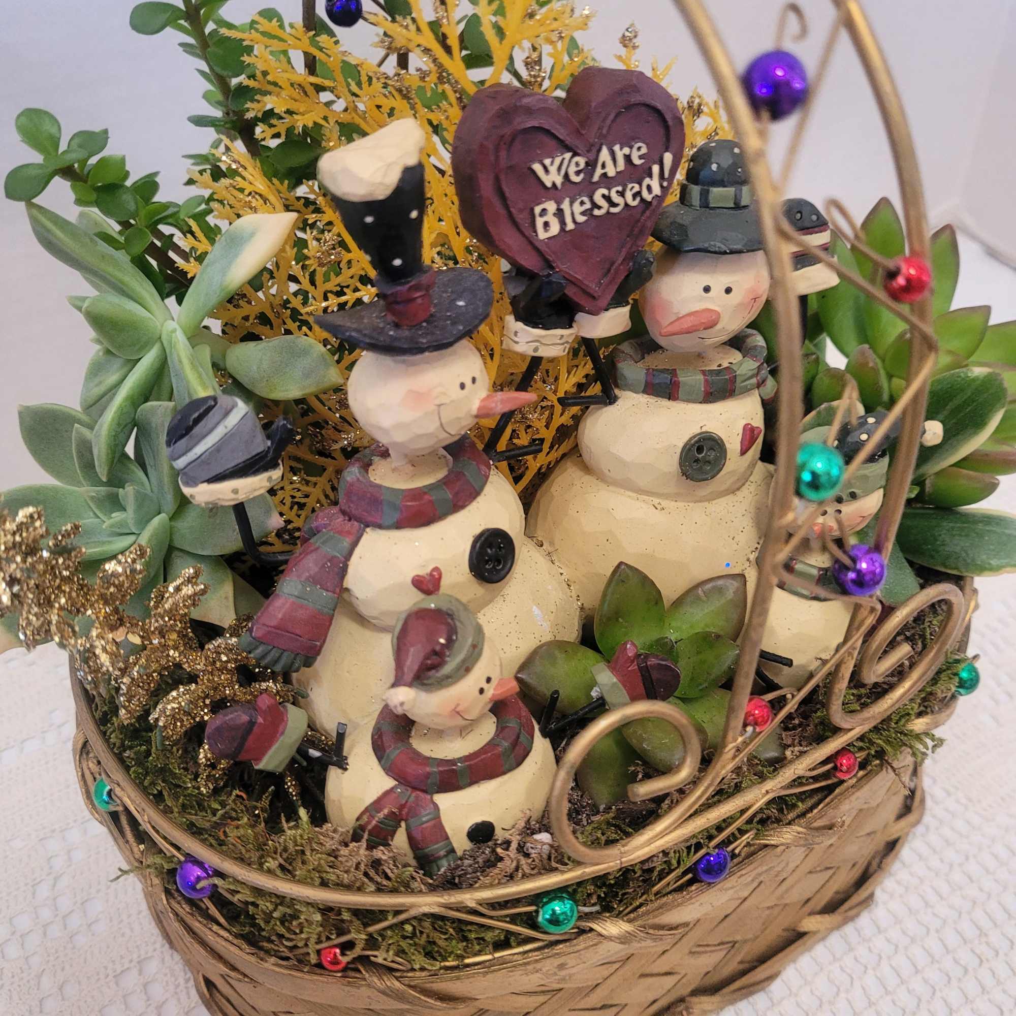 This wire and woven basket is filled to the brim with succulents