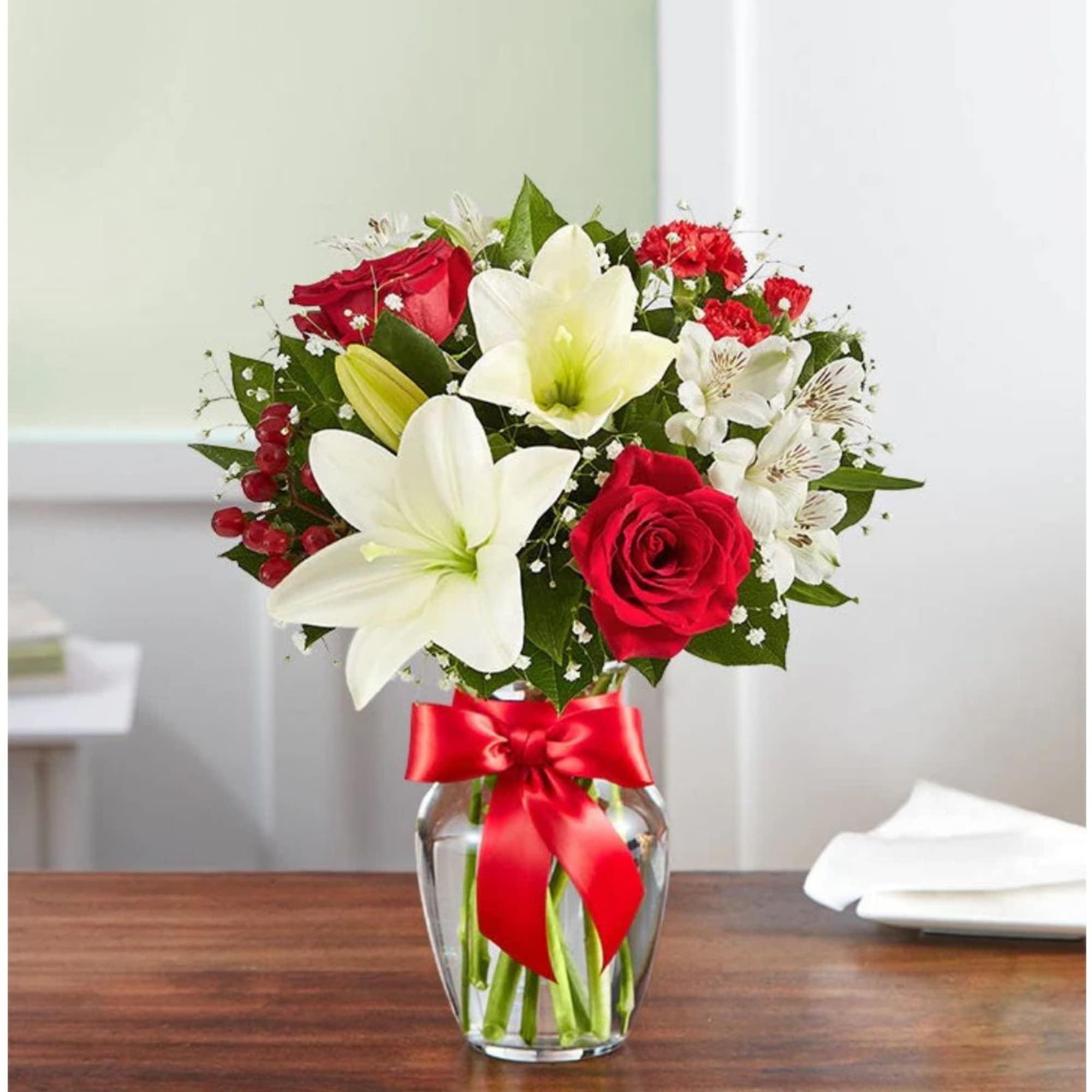 Fresh-picked red &amp; white blooms are hand-arranged in a glass vase. 

Please
