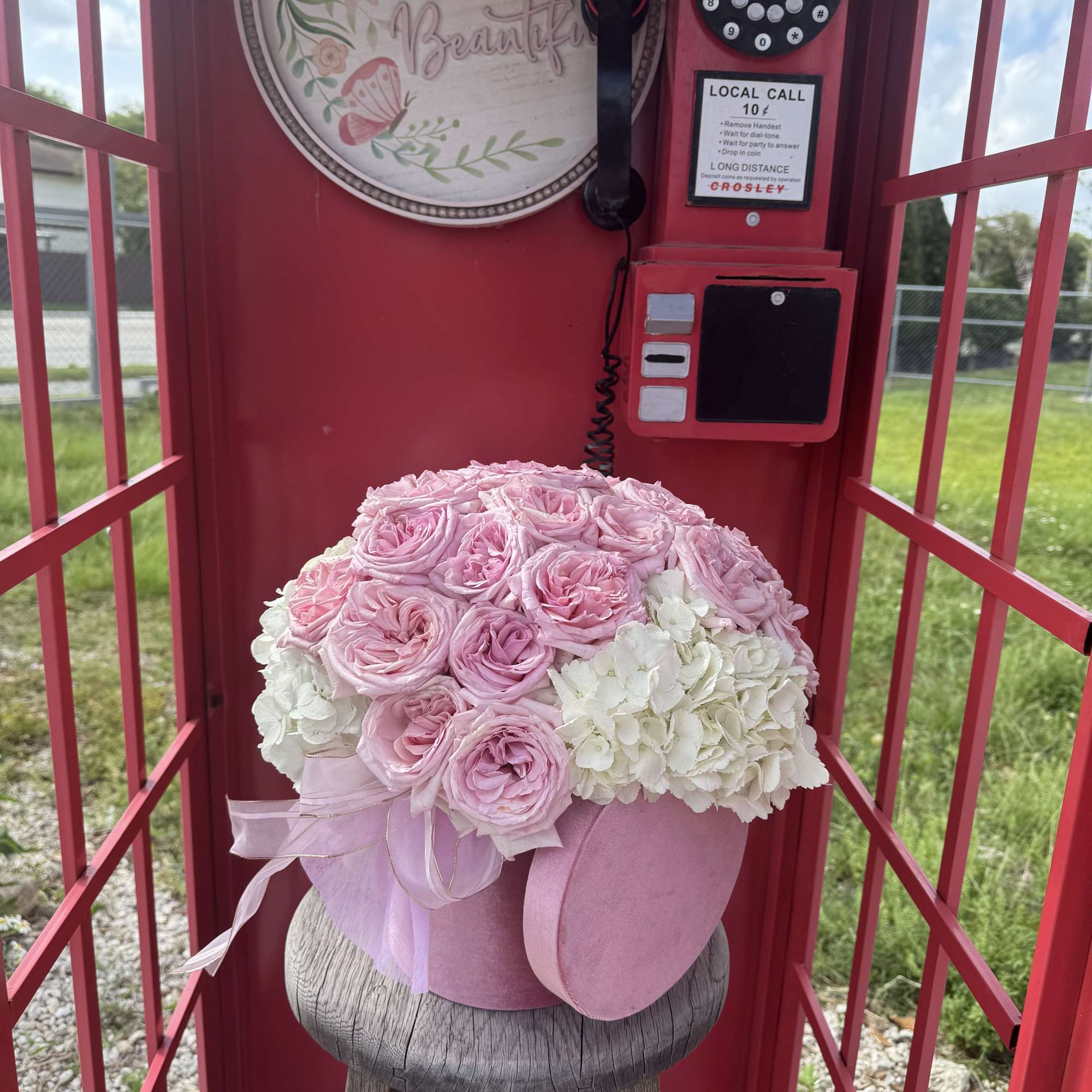 A box with hydrangeas and 12. roses