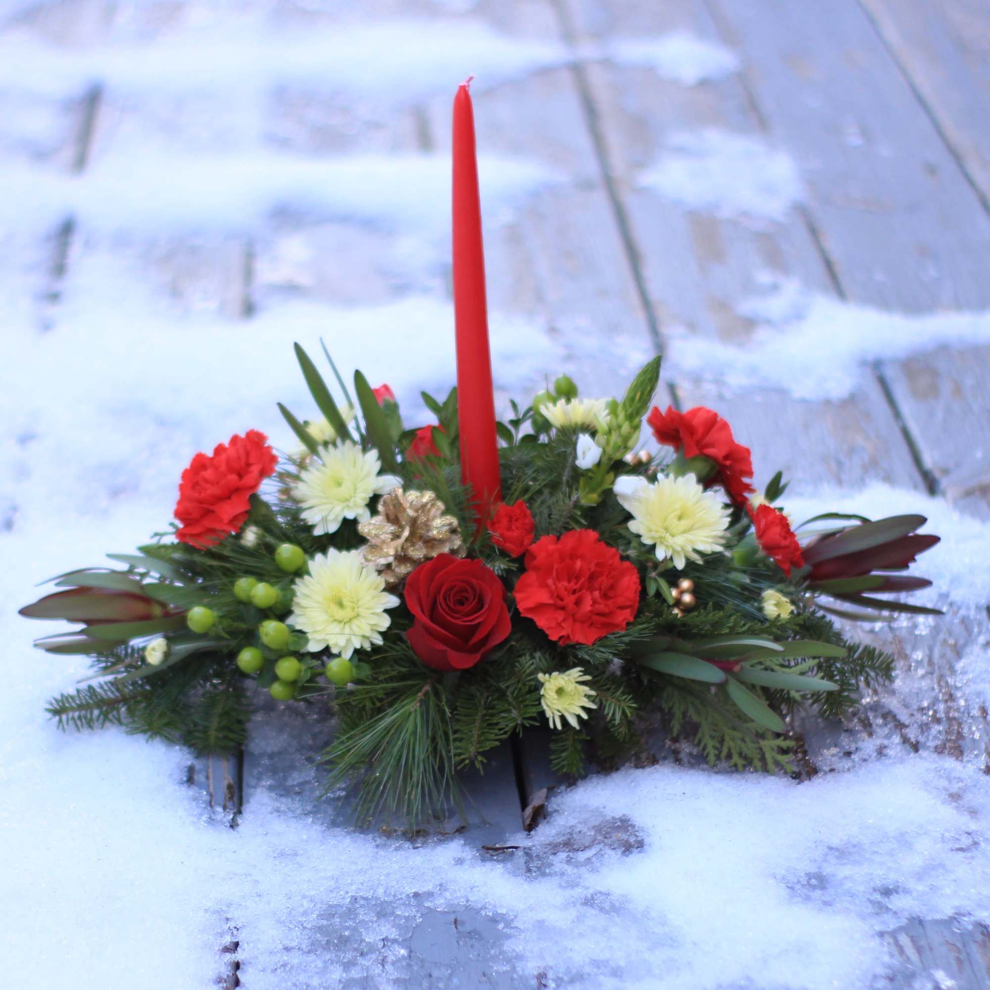 Light up your holidays with a single candle centerpiece created by Lucille