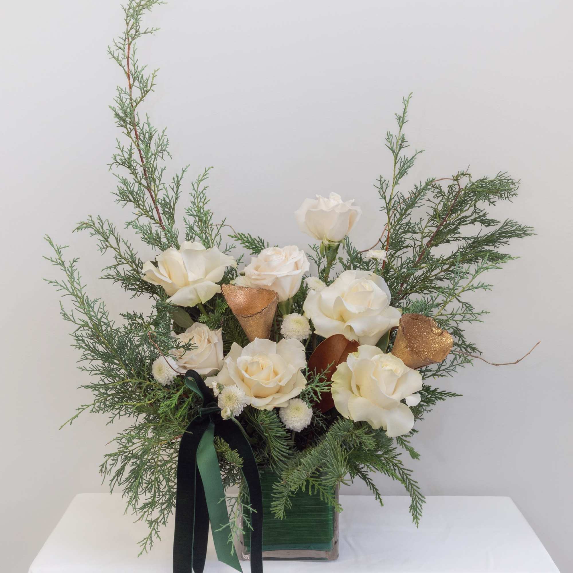 Soft, serene, and effortlessly elegant&mdash;this winter arrangement blends crisp white ranunculus with