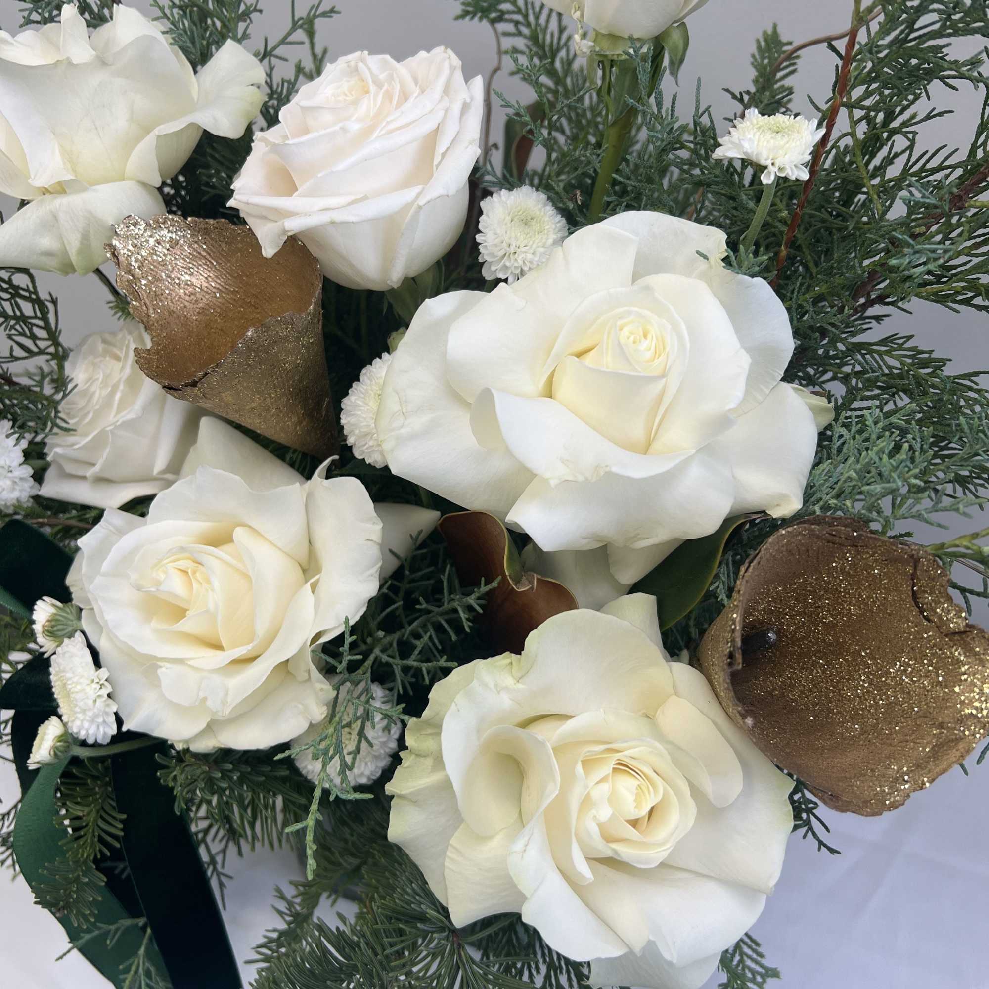 Soft, serene, and effortlessly elegant&mdash;this winter arrangement blends crisp white ranunculus with