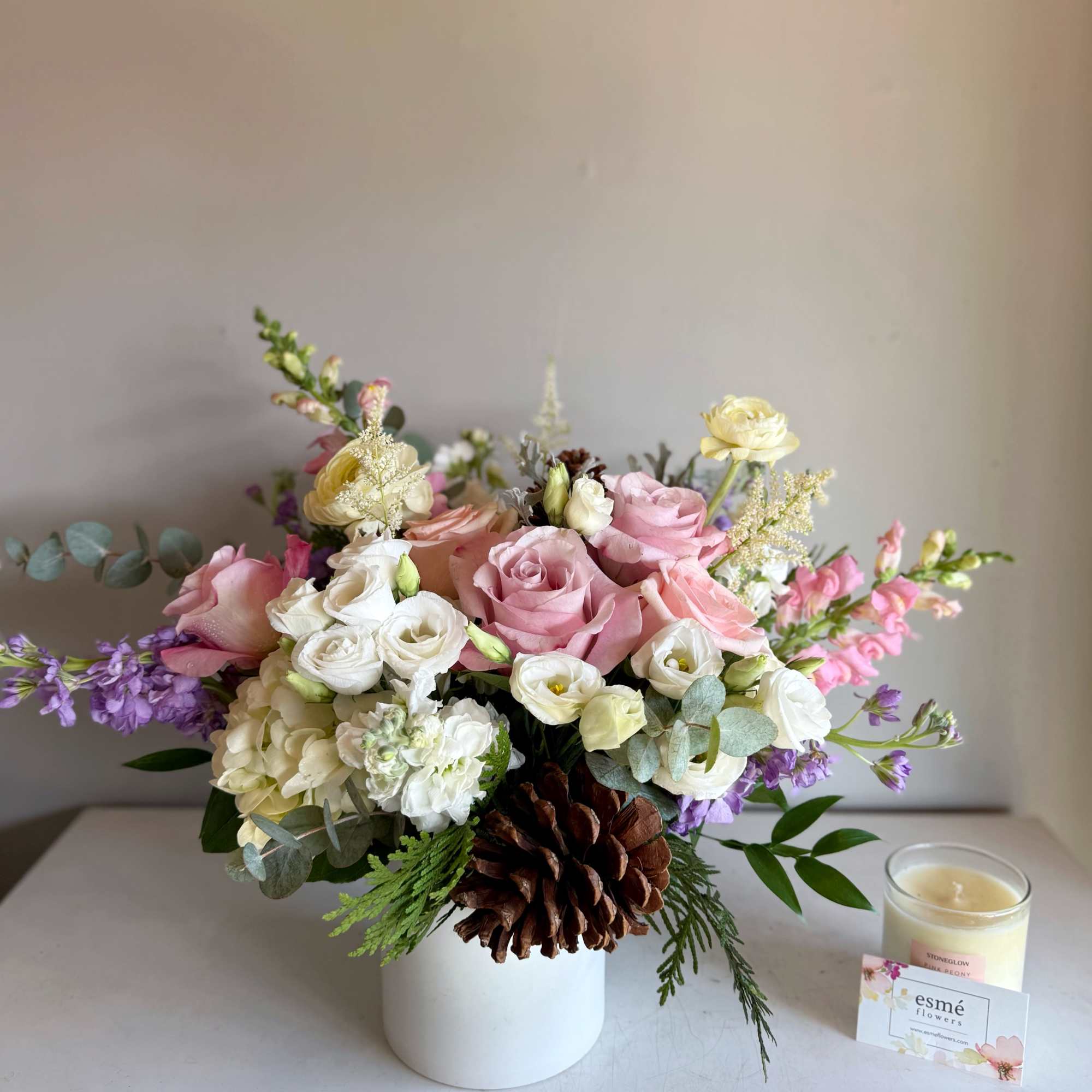 With blush petals, frosty white accents, and a hint of lavender glow