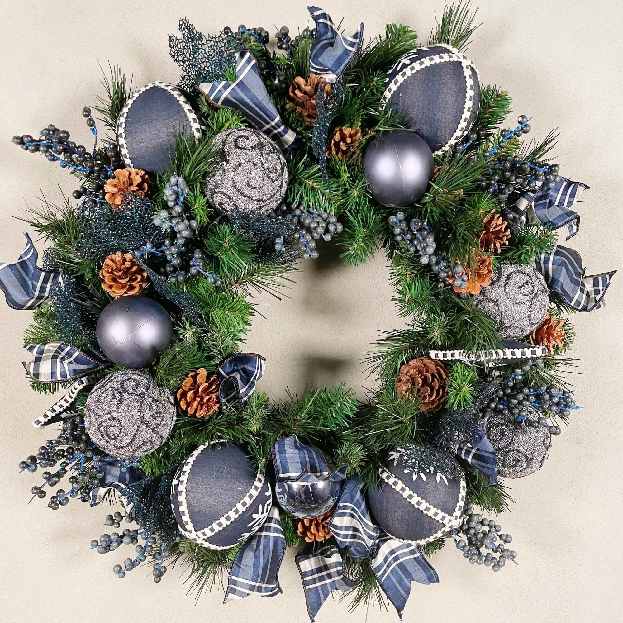 A holiday wreath in a cool shade of denim blue. 