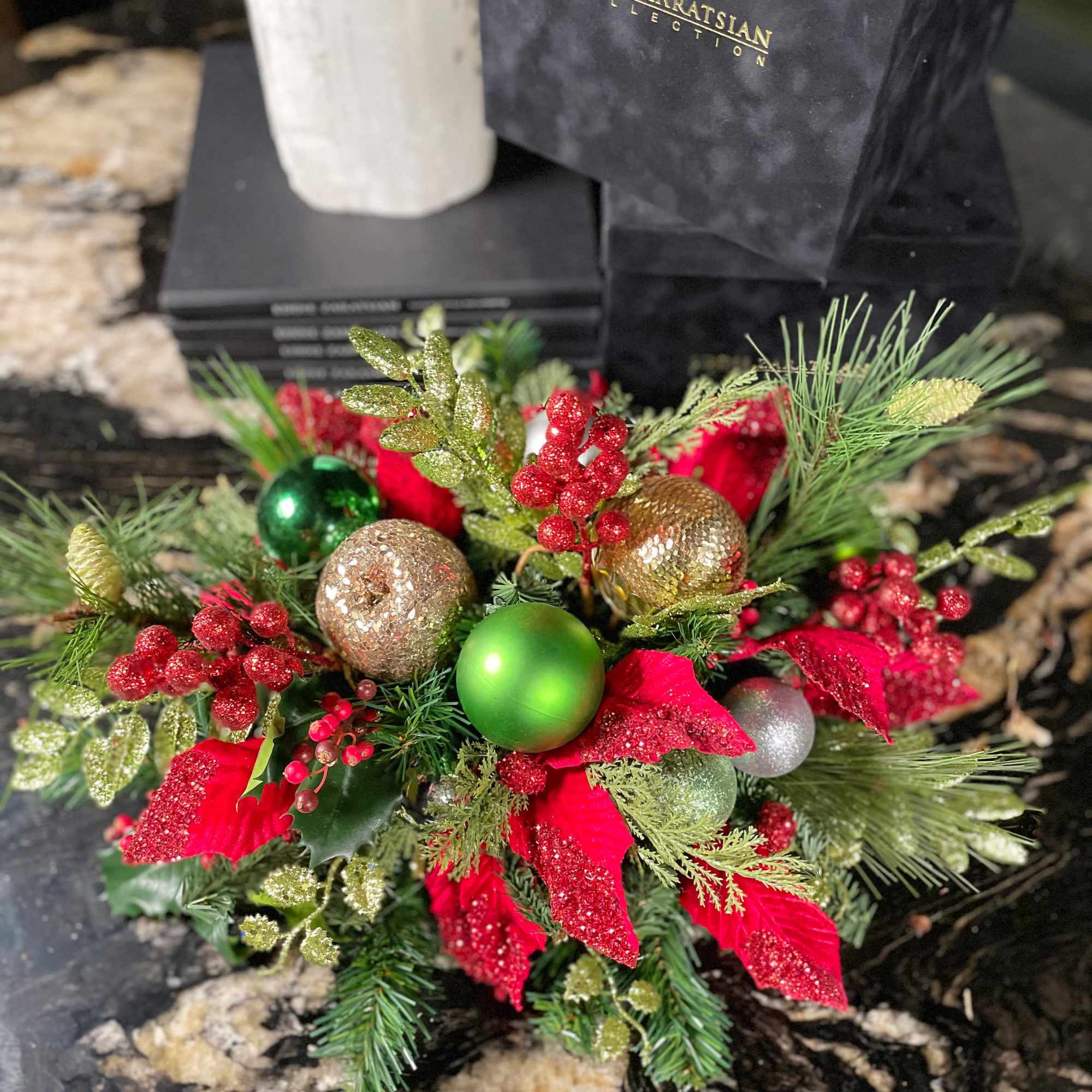 A traditional holiday wreath with beautiful red and green ornaments and a