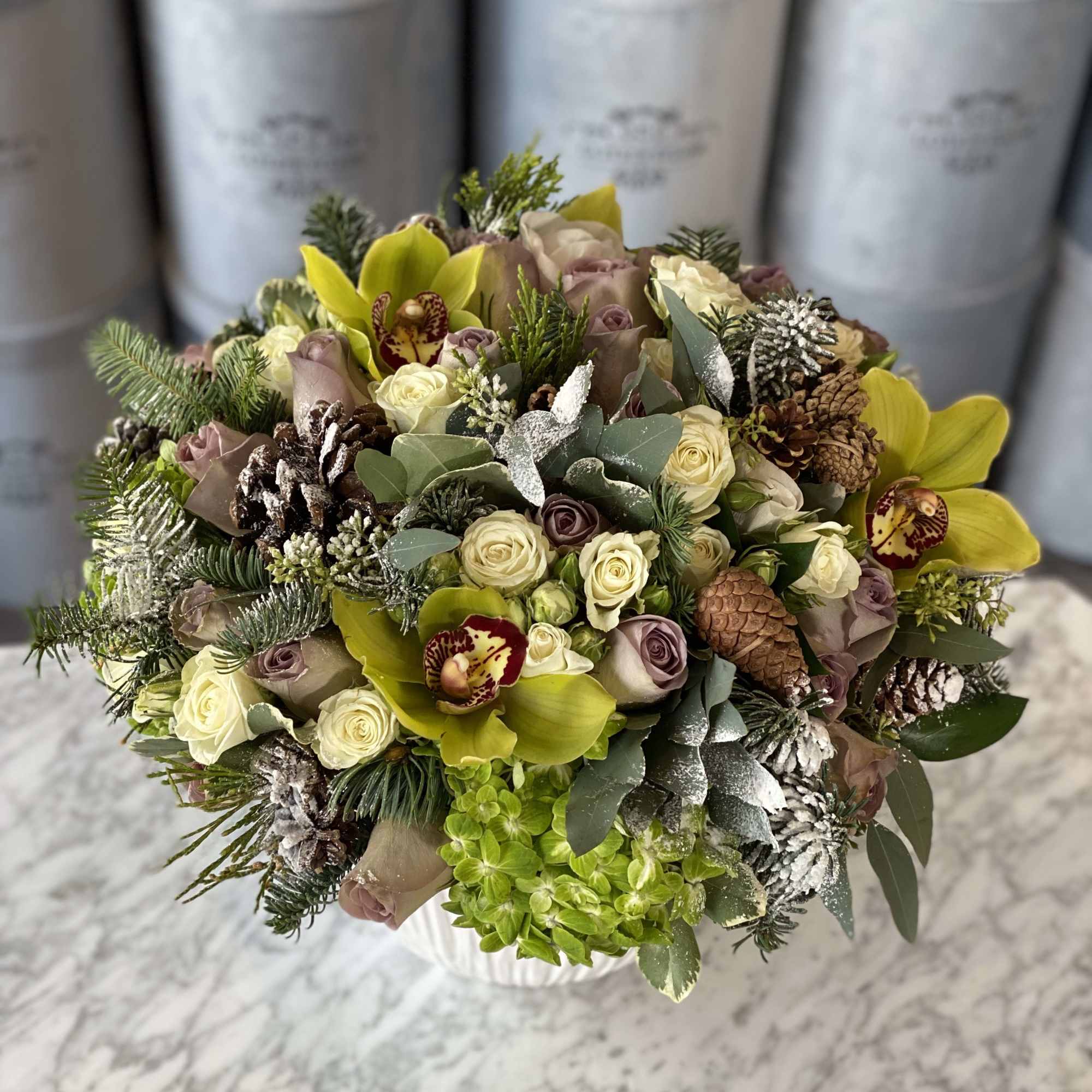 This seasonal beauty features our roses, orchids, hydrangeas, and other seasonal accents!