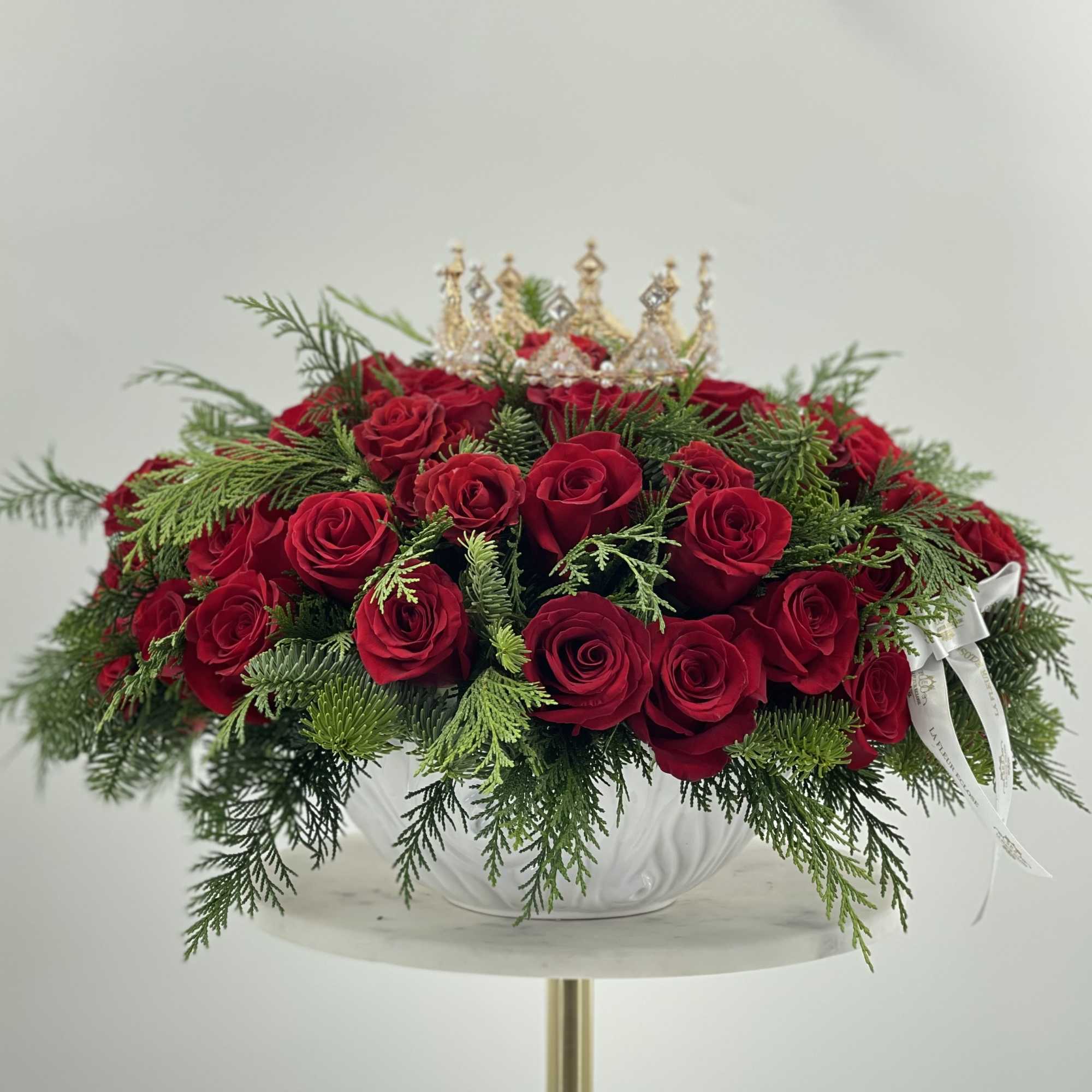 Beautiful Christmas Vase with red roses, topped with a lovely crown. 