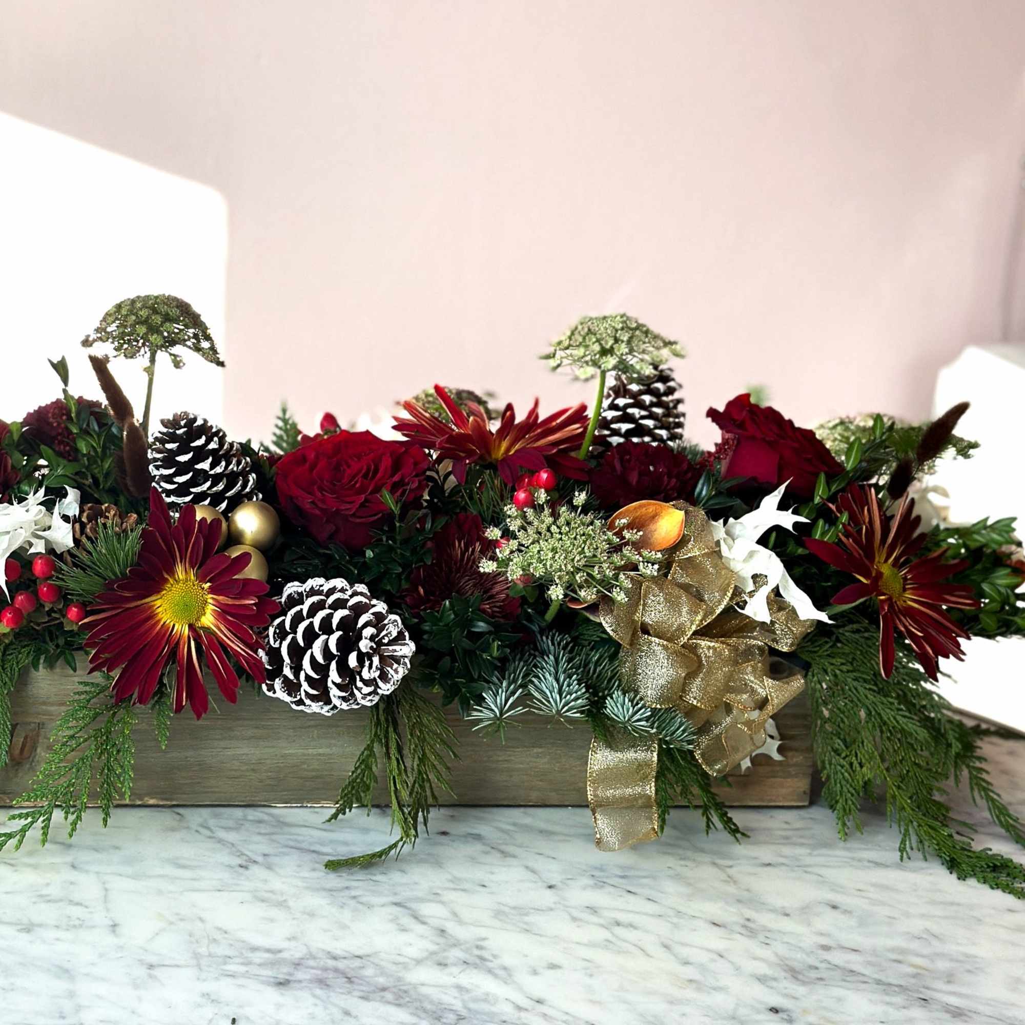 A mix of neutral reds, pinecones and fresh winter greens 

approx 18&quot;