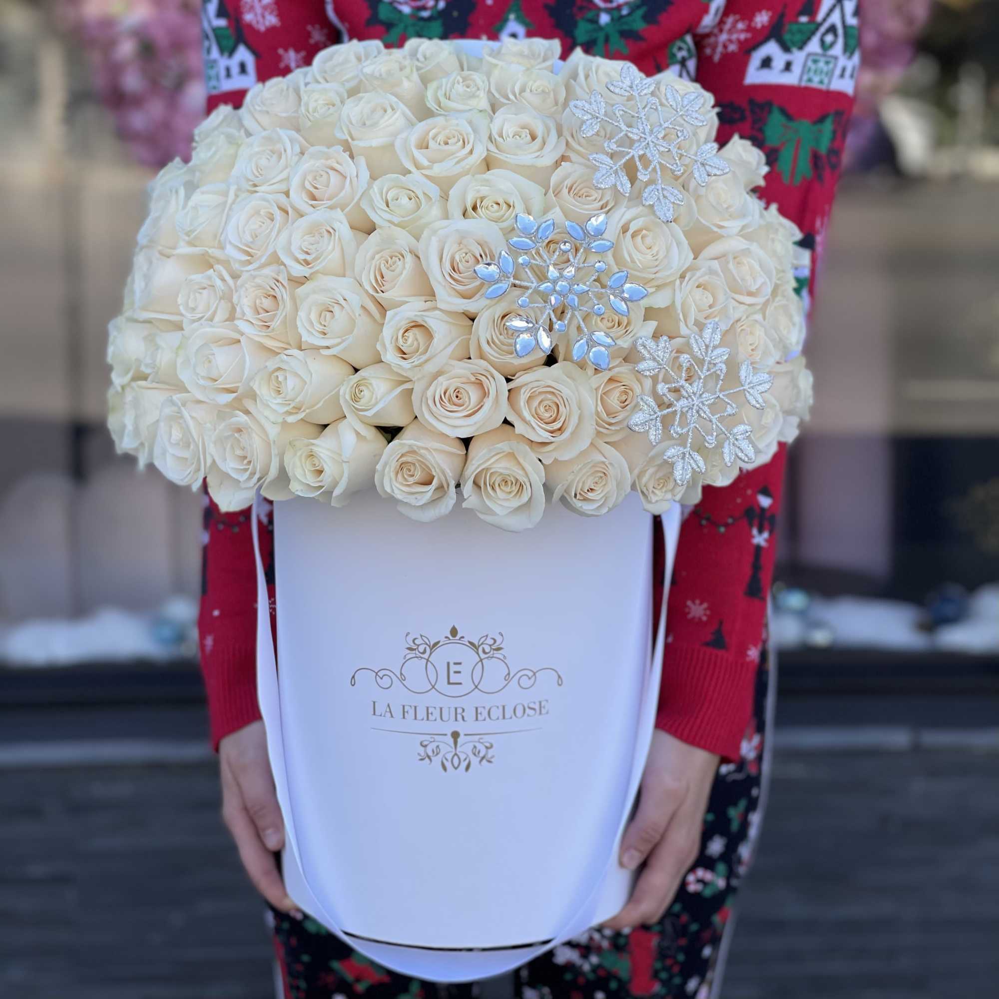 75 white roses in our signature white box with snow flakes 
Premium